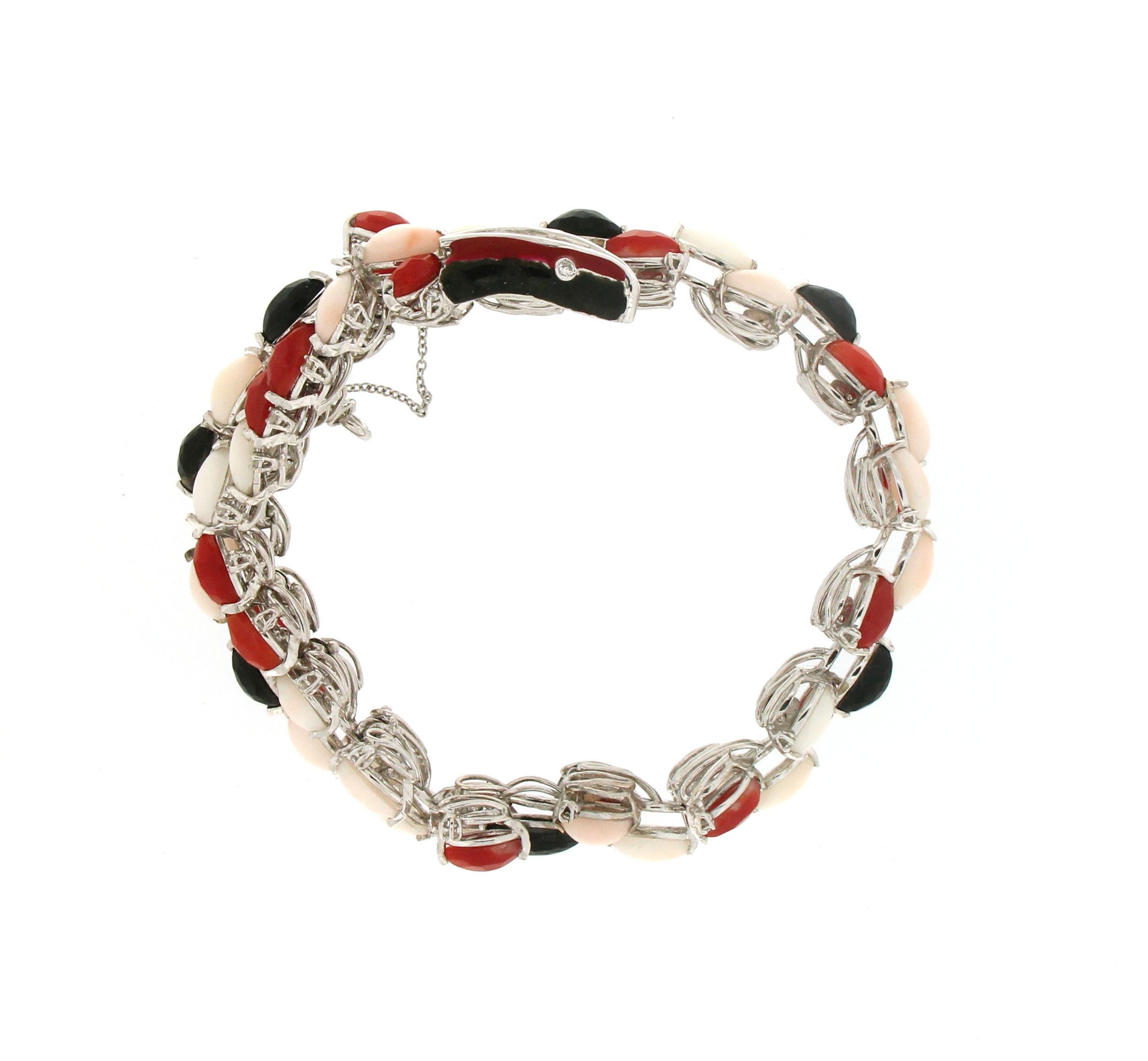 Artisan Handcraft Snake 18 Karat White Gold Diamonds Coral and Onyx Cuff Bracelet For Sale