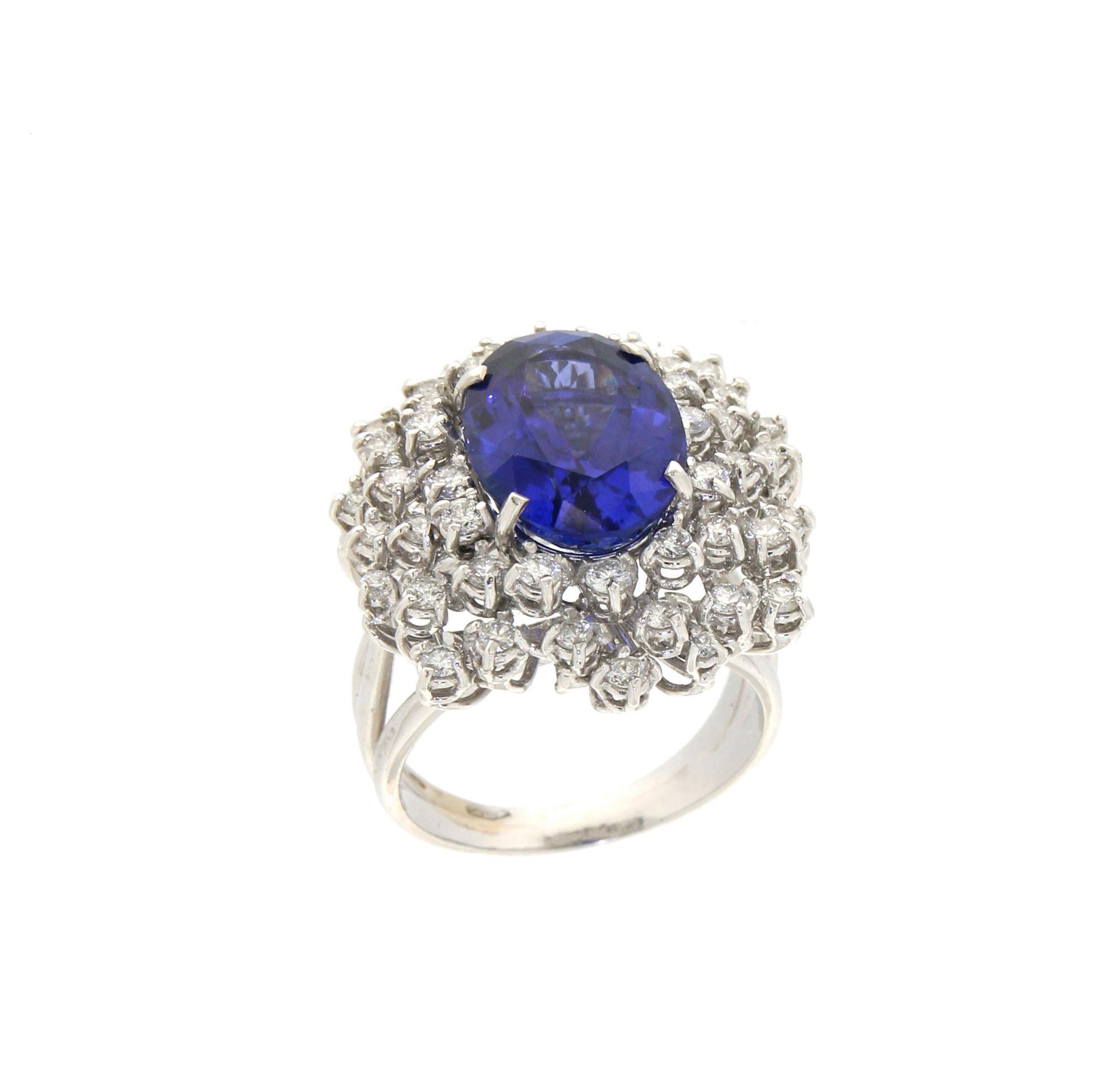 18 karat white gold cocktail ring. Handmade by our artisans assembled with tanzanite and diamonds.

Tanzanite weight 7.44 karat
Diamonds weight 1.25 karat
Ring total weight 13.70 grams
Ring size 8.15 US 17.20 Ita

(all rings are can be resized)