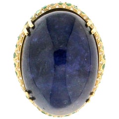 Anillo de cóctel de tanzanita artesanal de oro amarillo de 18 quilates con diamantes y esmeraldas