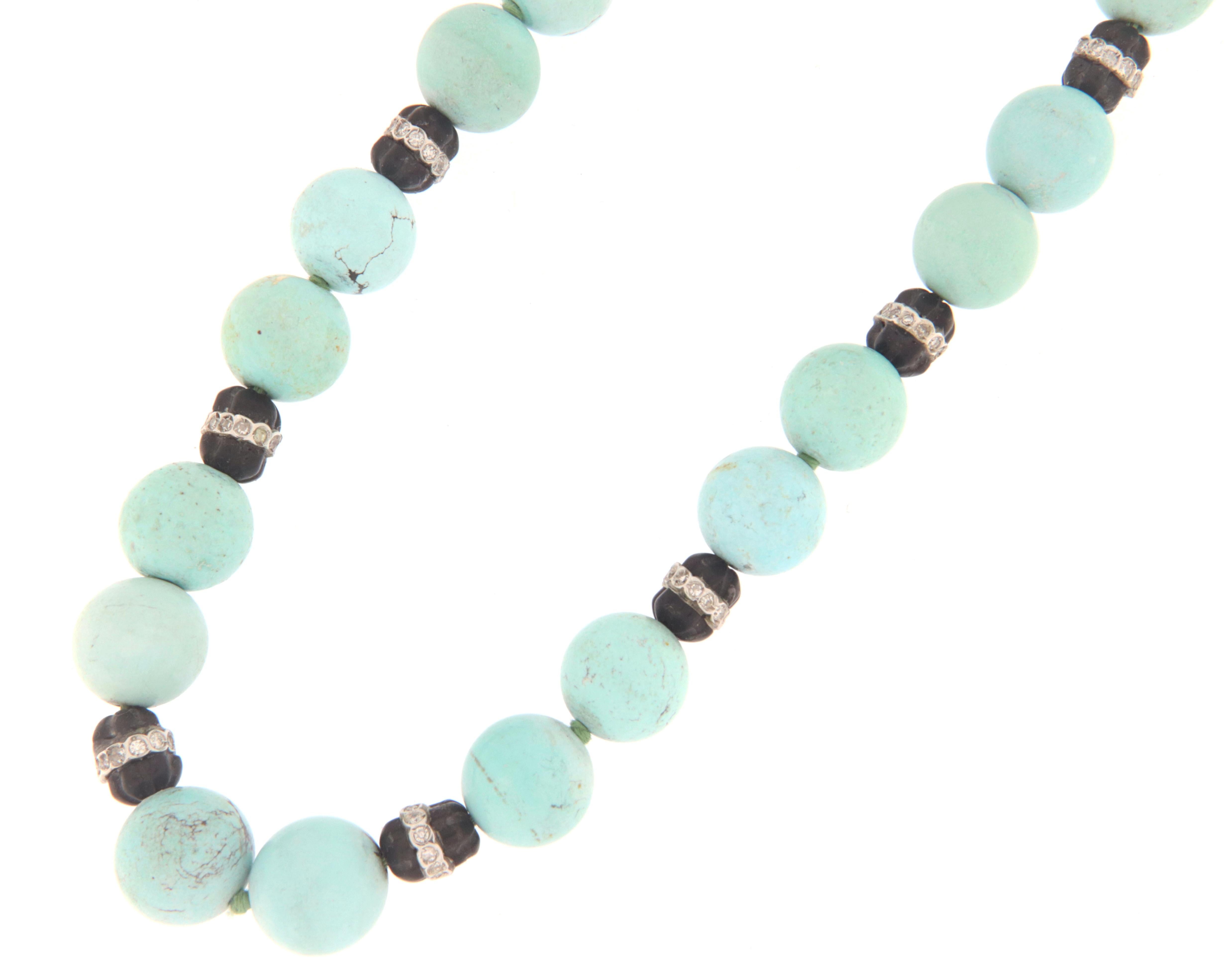 18 karat white gold beaded necklace. Handmade by our artisans assembled with turquoise beaded,onyx and diamonds.

Necklace total weight 56.60 grams
Diamonds weight 1.50 karat
Turquoise single ball 12 mm
Necklace length 48 cm