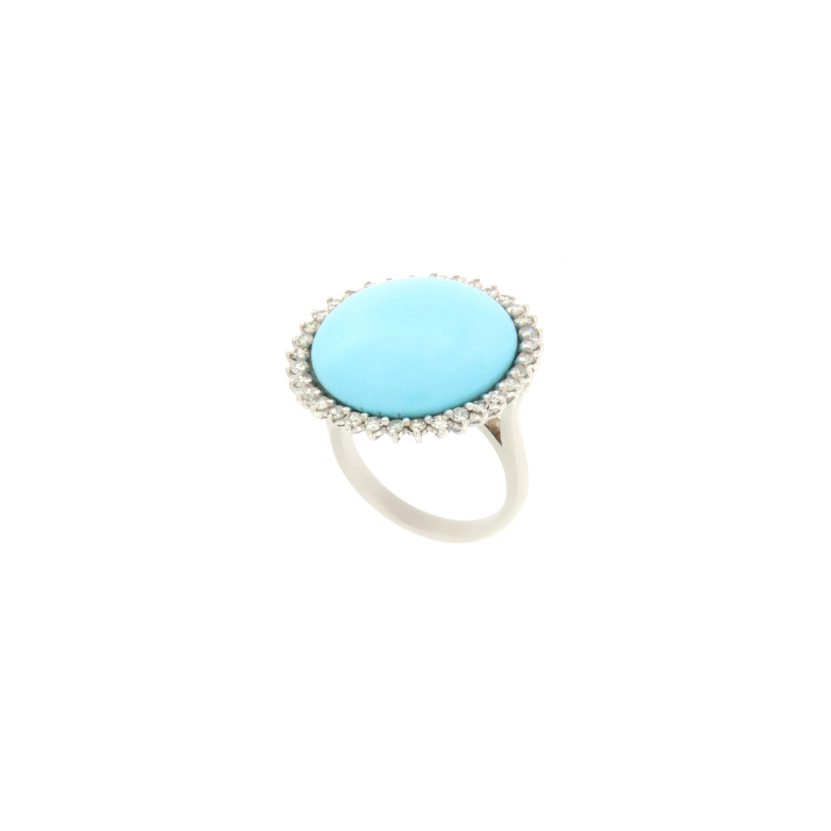 18 Karat white gold cocktail ring. Handmade by our craftsmen and assembled with natural turquoise and diamonds.

Diamonds weight 0.76 karat
Turquoise weight 3.50 grams
Ring total weight 10.30 grams
Ring size ITA 15 - US 7.50
(all rings are can be