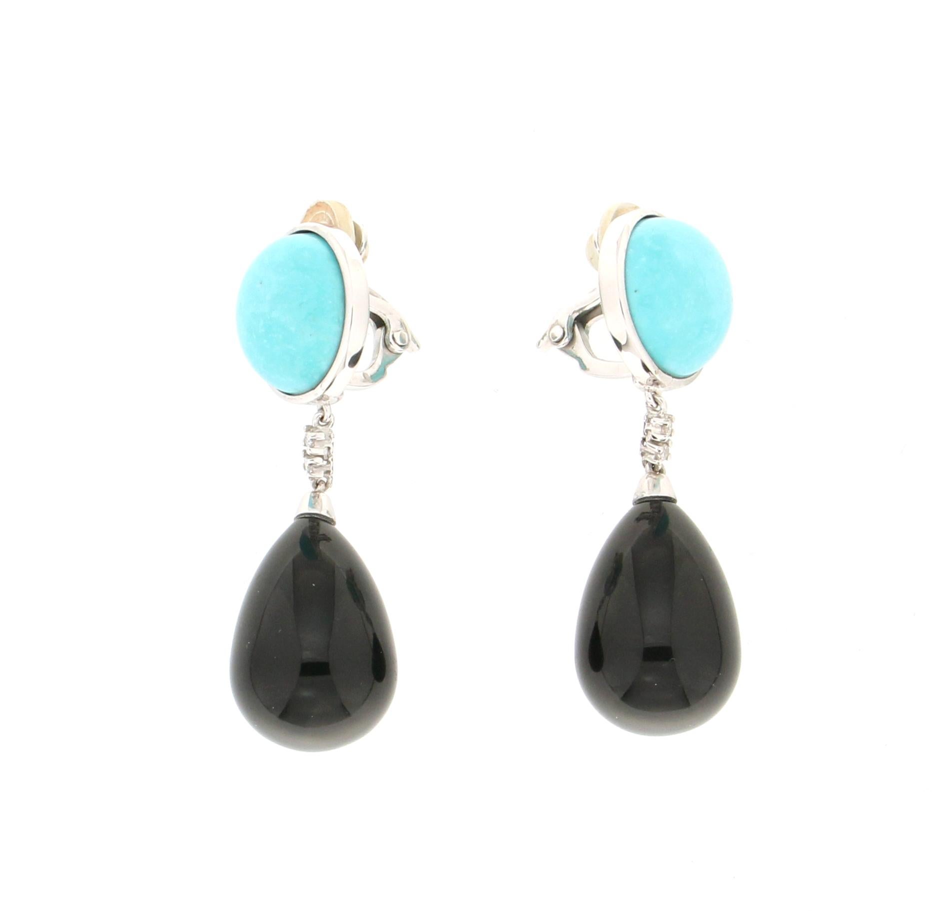 18 Karat white gold drop earrings. Handmade by our craftsmen and assembled with onyx, turquoise and diamonds.

Diamonds weight 0.10 karat
Turquoise weight 3.80 grams
Earrings total weight 20.20 grams
