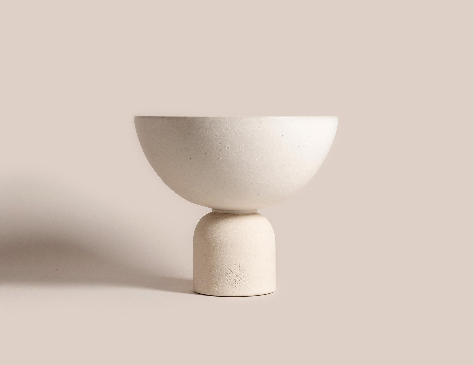 Handcrafted 015 Coupe by Lovebuch
Dimensions: Ø 21 x H 16 cm
Materials: Sandstone, Handcrafted piece

Katia works with wood and clay, these raw, powerfully expressive materials are shaped to create a poetry of objects that inhabit our daily