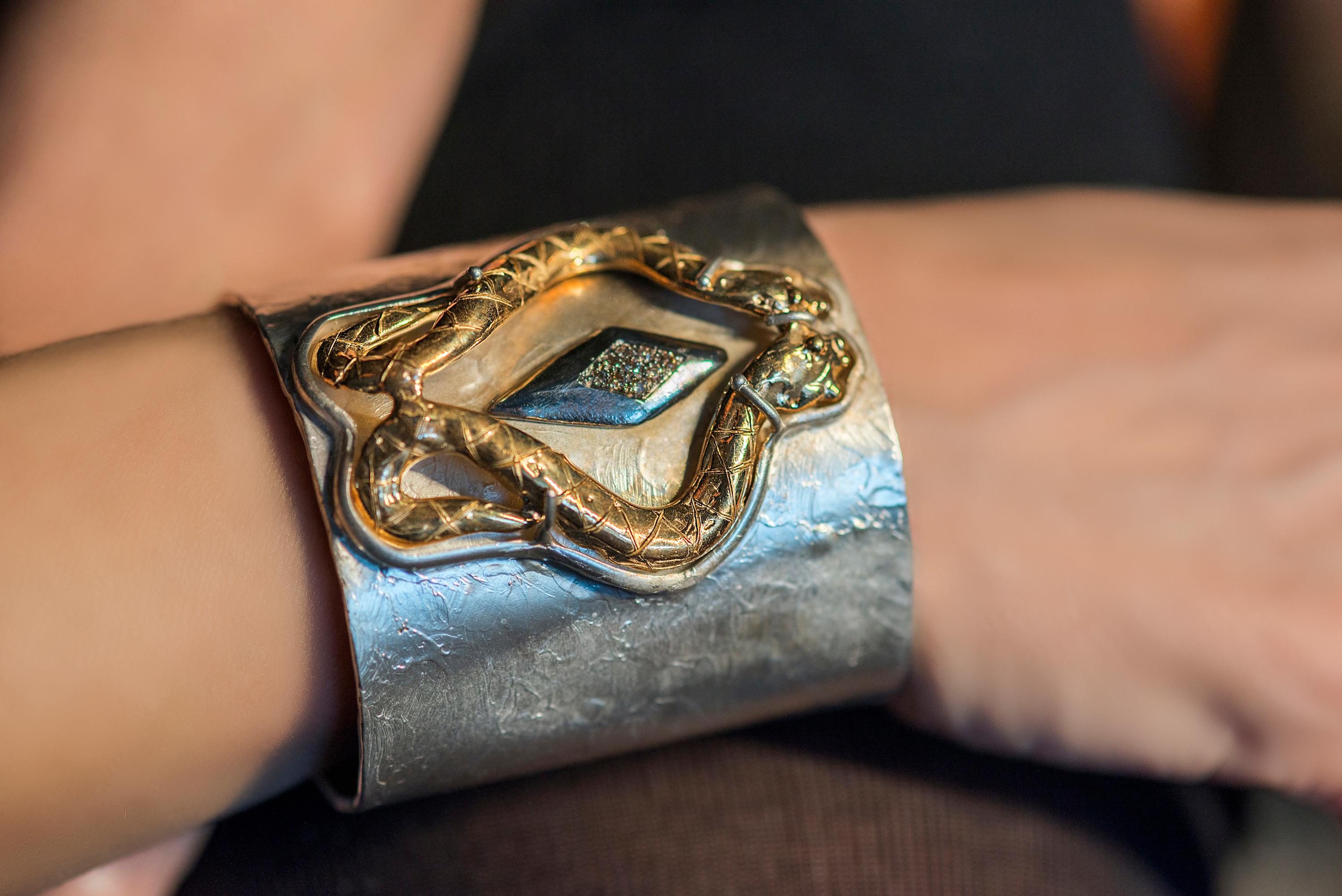 Introducing the mesmerizing Snake Cuff Bracelet by Rossella Ugolini, a unique piece handcrafted in Italy. This fierce and sensual cuff bracelet exudes an air of captivating elegance, adorned with exquisite details. Crafted in 24 Karat Gold Plated