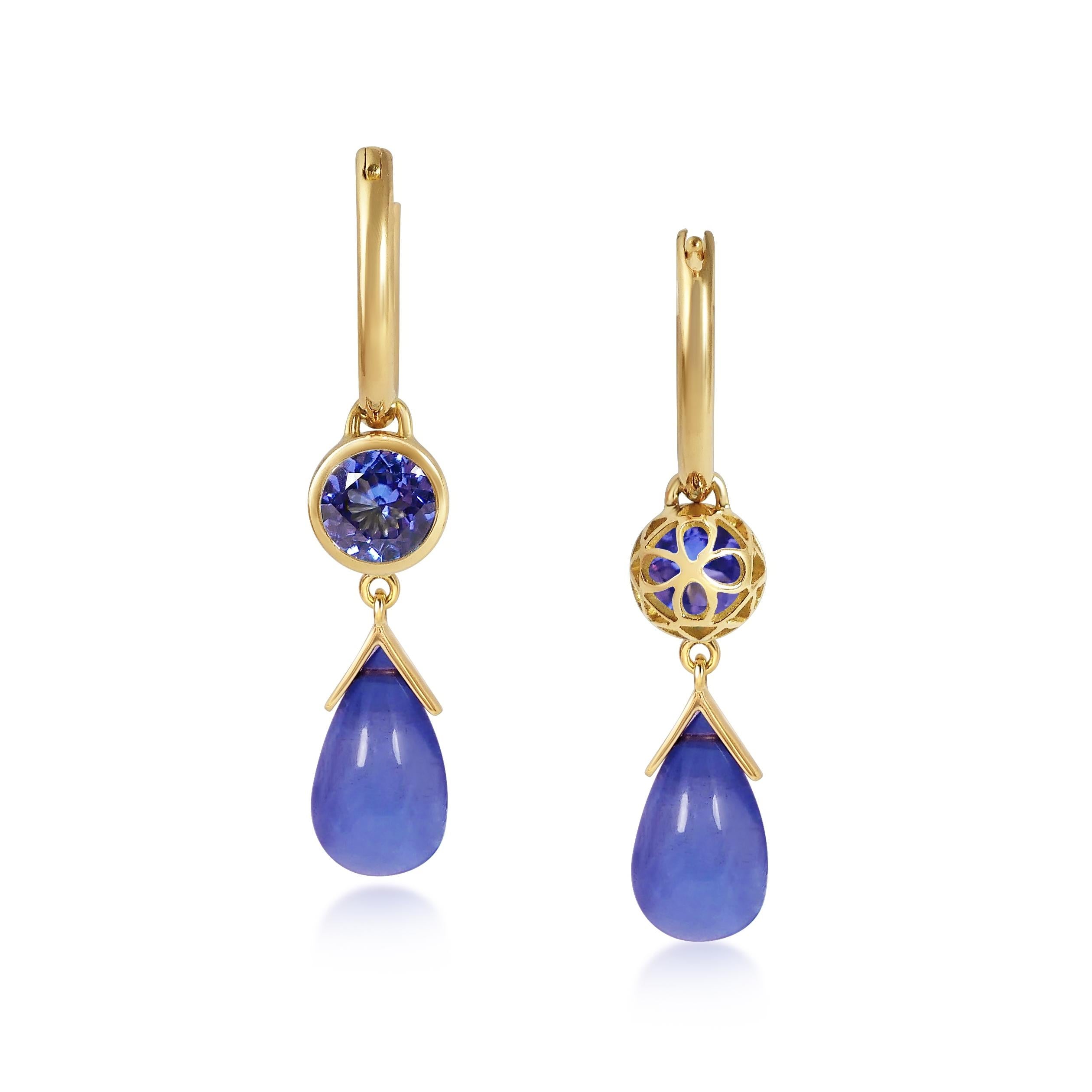 Handcrafted 1.10 & 4.00 Carats Tanzanite 18 Karat Yellow Gold Drop Earrings. Dancing drops carved in Tanzanite under a set of 6mm round cut Tanzanite stones encased in our iconic hand pierced gold lace to let the light through. A diamond has been