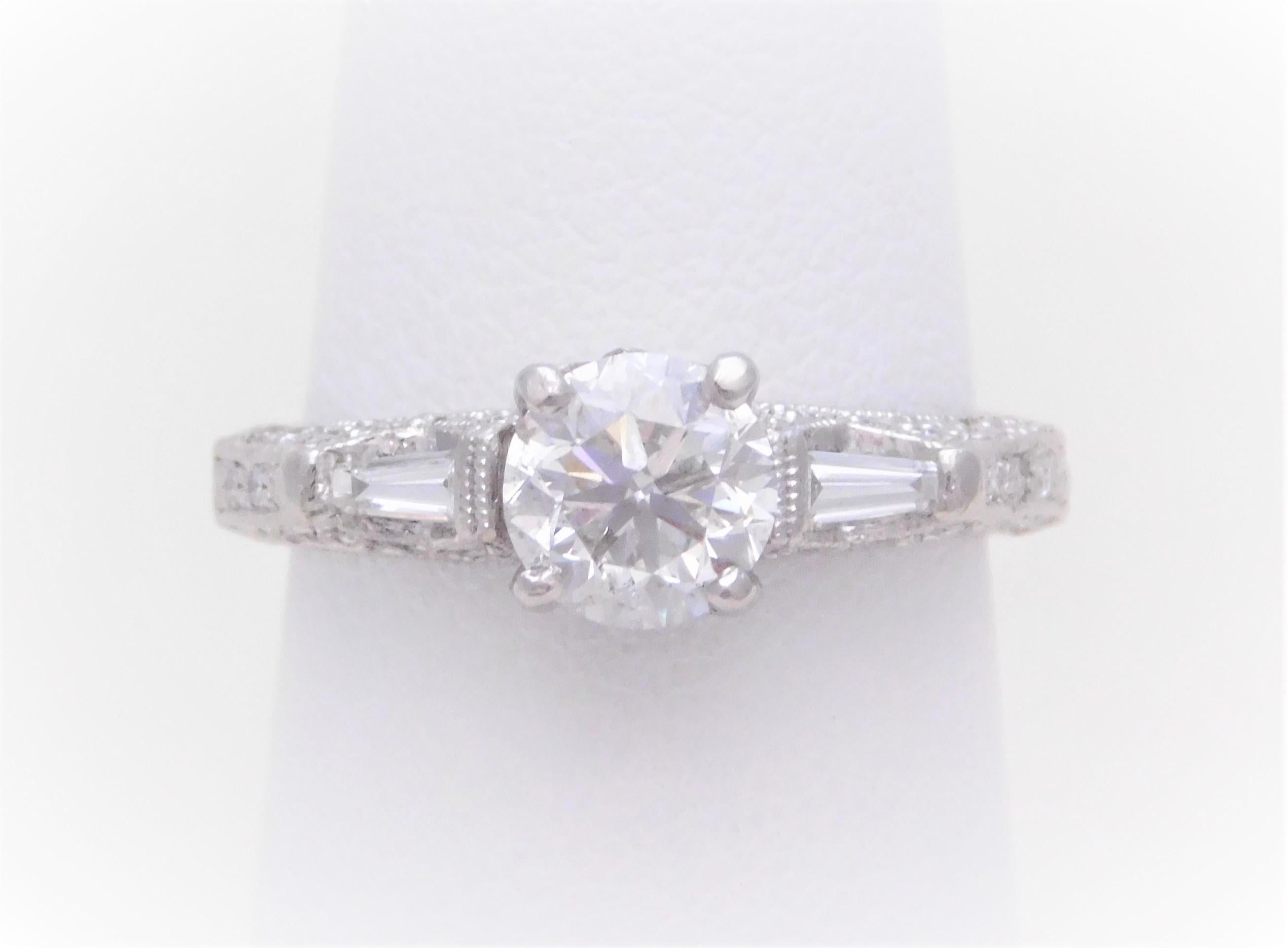 A signed estate piece.  Handcrafted in solid 900 platinum, this gorgeous engagement-style ring is perfect for someone who loves the look of hand-made antique jewelry.  The engagement ring is signed by the designer Parade.  Parade is a luxury jewelry