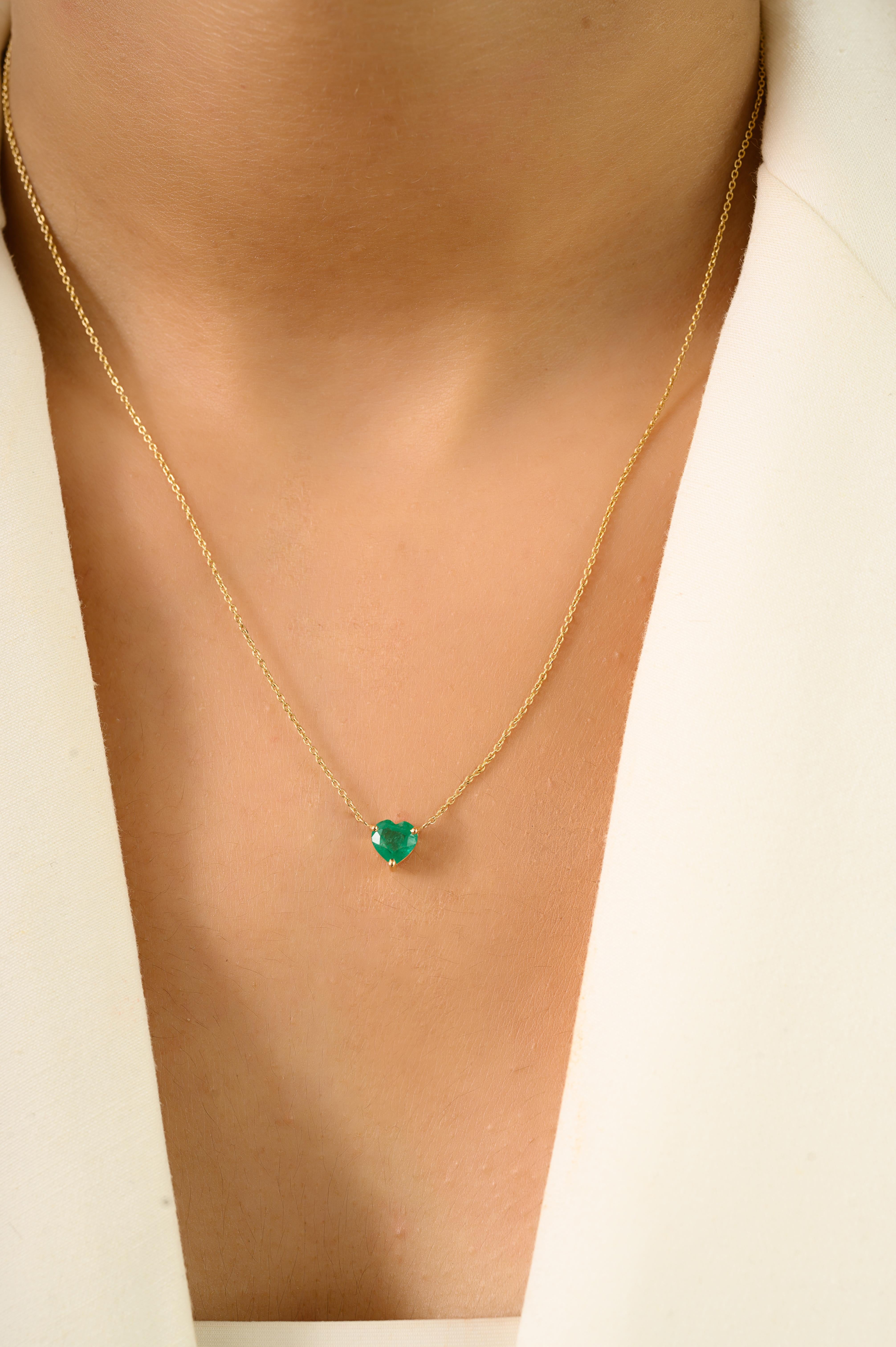This elegant necklace features a 0.89 carat heart cut emerald, securely held in a three prongs in 14K yellow gold setting that highlights the stones rich green hue. The emerald is suspended from a fine 14K yellow gold chain, designed for everyday