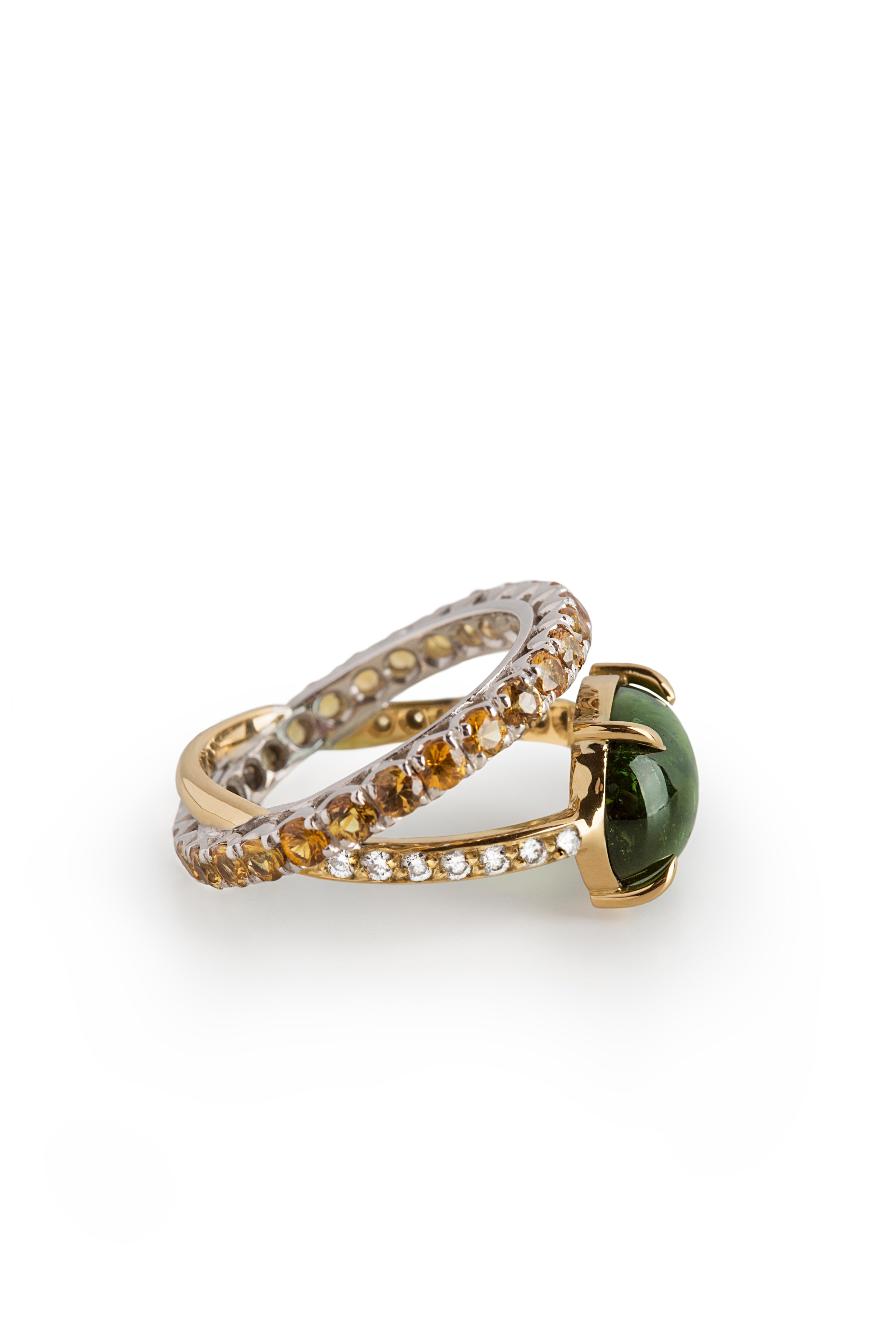 Rossella Ugolini Design Collection, Modern 18 K Gold Green Tourmaline 0.10 Karat White Diamonds Orange Mandarine Sapphires Ring.
This deep green aura ring is totally handcrafted in 18 karats Yellow and white gold, adorned with a 4.26 Karat Green
