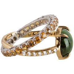 Used Modern 18 K Gold 4.26 karat Green Tourmaline 0.10 Karat Diamonds Sapphires Ring