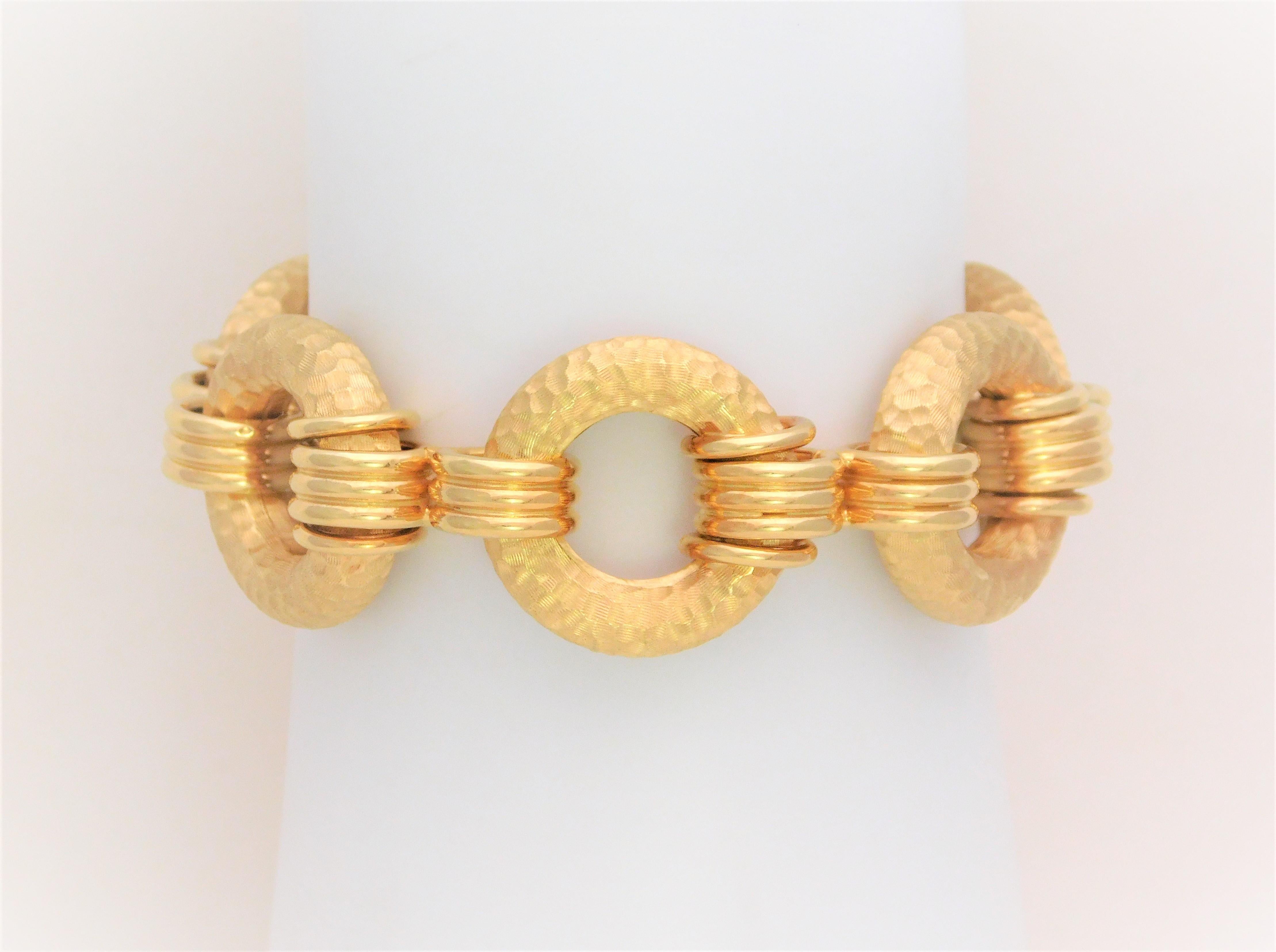 Hand Crafted in Thailand and in new condition.  This link-style bracelet has been forged from solid 18k yellow gold.  Its design is breathtaking!  If you are one of those ladies’ who love big, bold, and unique bracelets without being too heavy on