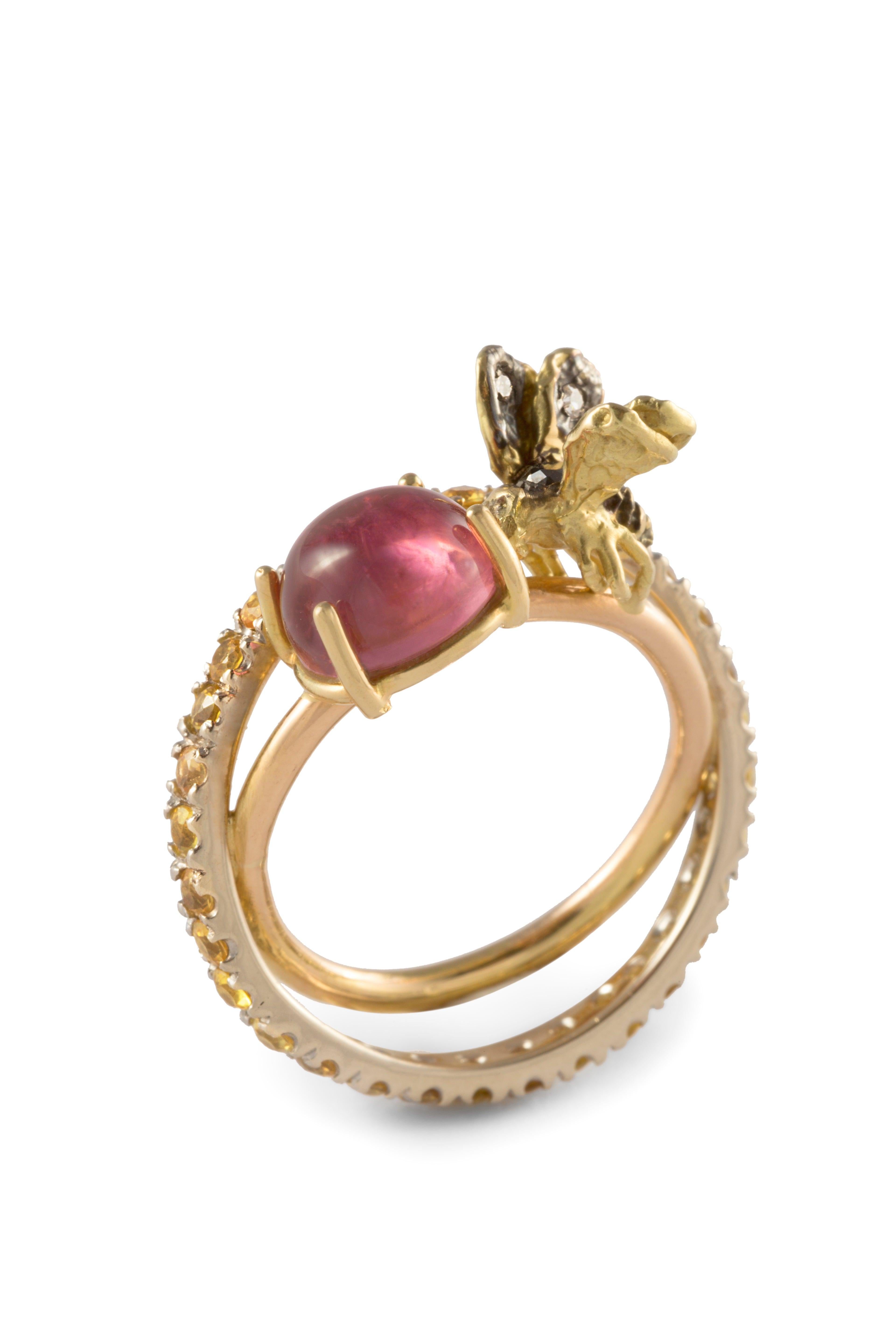 Handcrafted Rossella Ugolini Design Collection  a beautiful Modern cocktail ring handcrafted in 18 karats yellow gold with a nice flying Bee adorned with 0.08 karats White and Black Diamonds. The Bee alights lightly on one 1 Karat pink Tourmaline