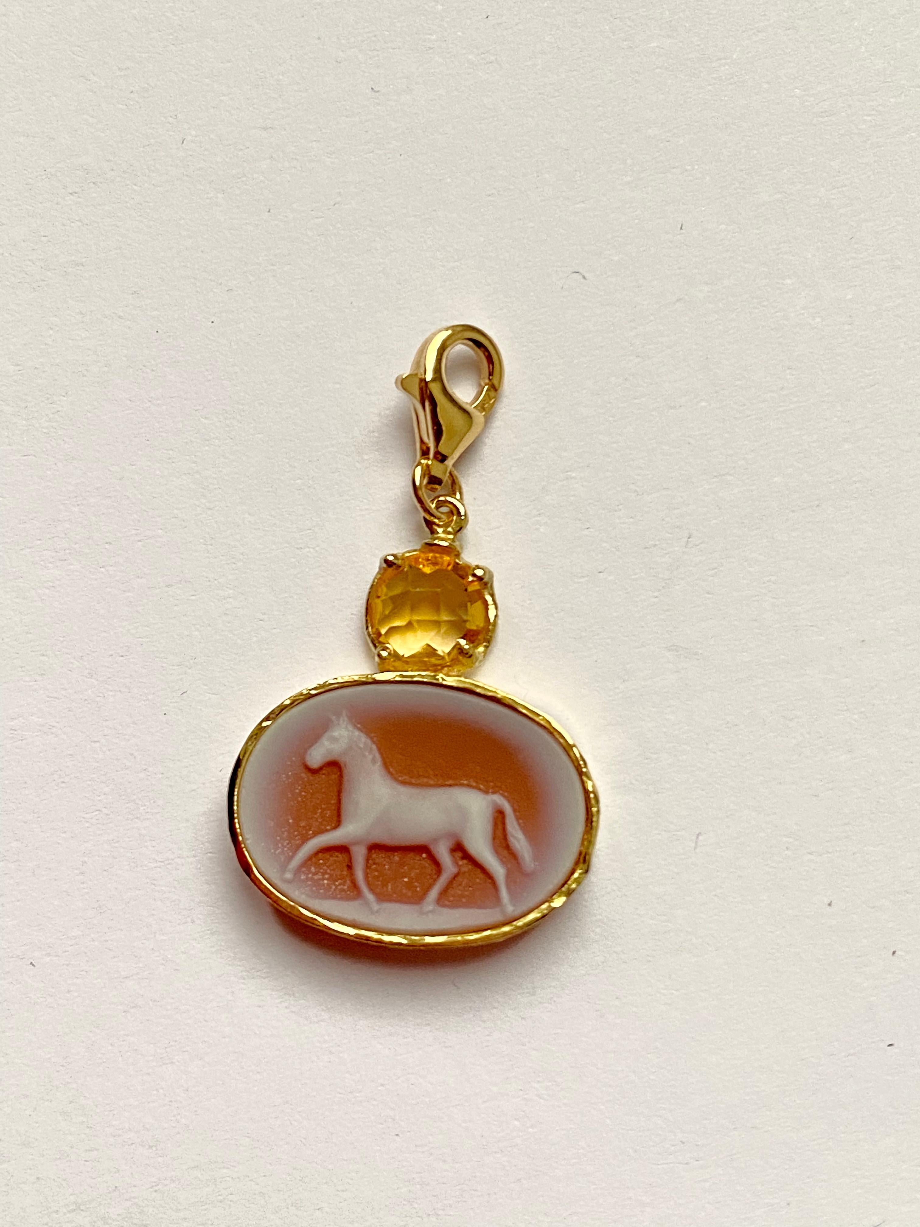 Handcrafted 18 Karats Yellow Gold Hammered Bezel Carnelian and Citrine Horse Charme Pendant 
A nice charme pendant handcrafted in 18 karats gold adorned with beautiful horse hand carved carnelian with a hammered gold bezel and a round citrine