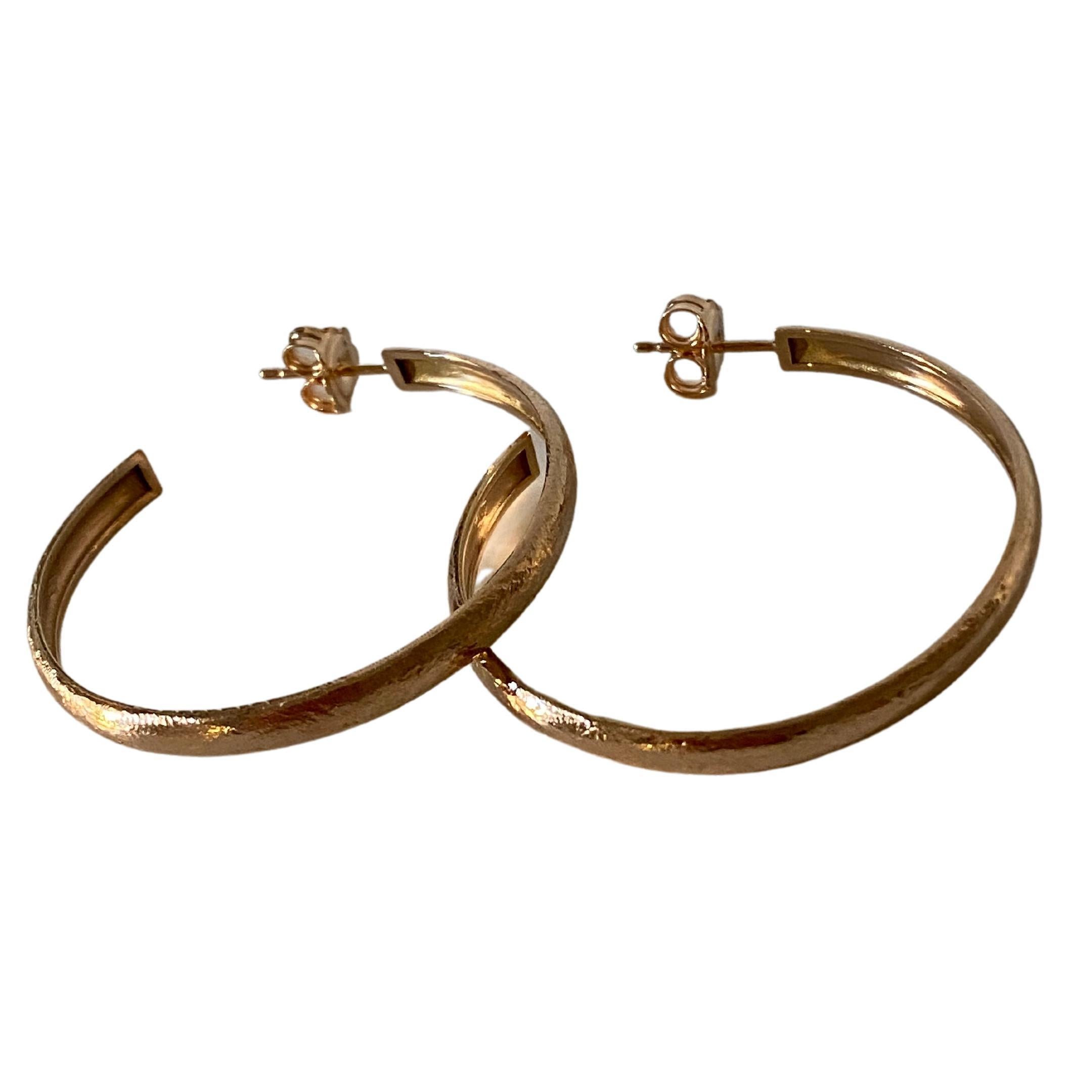gold hoops with design