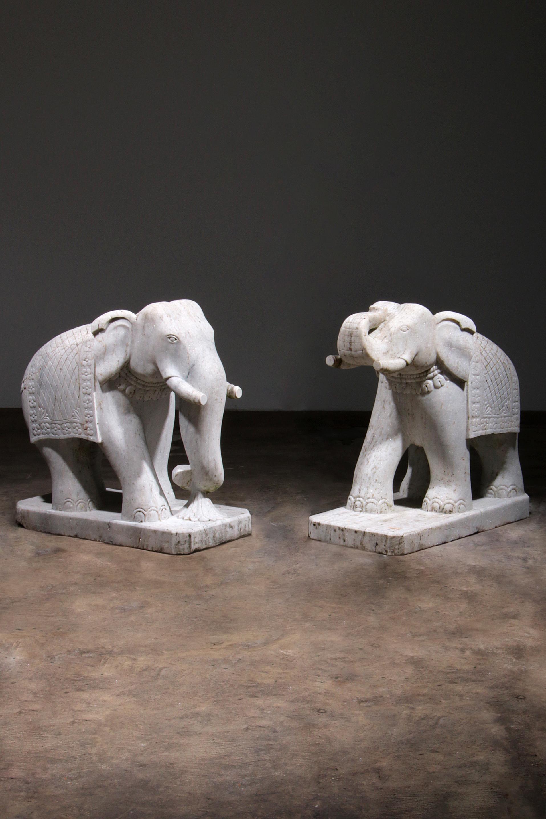 

Enhance your home or office decor with this exquisite set of 2 large marble elephant statues. Handcrafted with precision around the 1950s, these stunning pieces weigh 350 kg each and are made from high-quality great white marble. Purchased from a