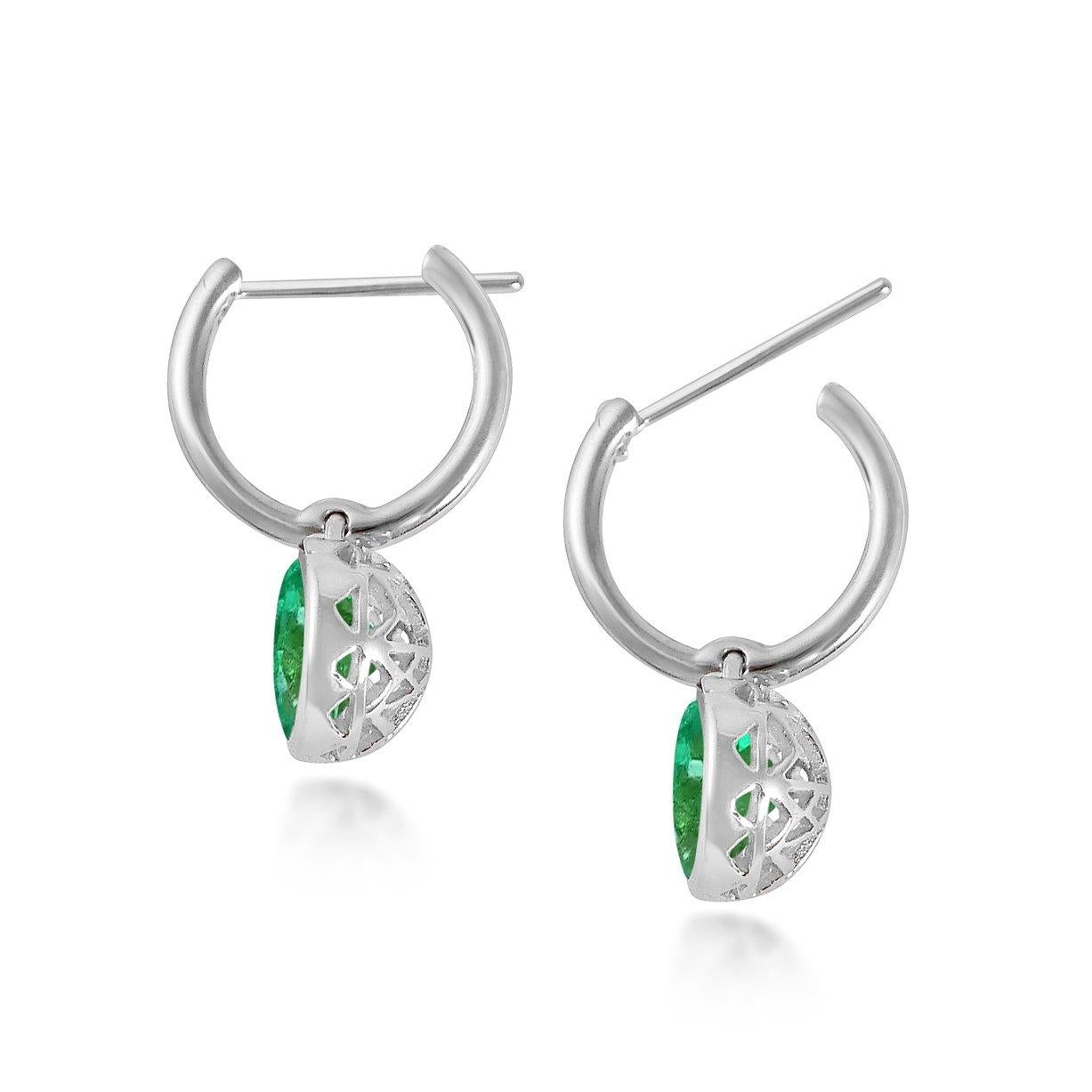 Handcrafted 2.00 Carats Emerald 18 Karat White Gold Drop Earrings. The 8mm natural stones are set in our iconic hand pierced gold lace to let the light through. Our precious and fine stones on our dangling earrings are highlighted by a diamond on