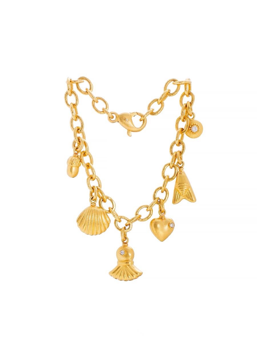 Handcrafted 24K Gold Charm  Bracelet 
Gold Weight        : 30.26 Grams 24K
Diamond Weight : 0,11 Ct's