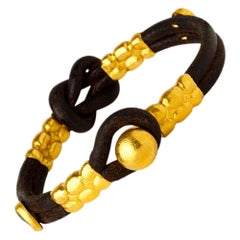 Bracciale in pelle con nodo di Eracle in oro 24 carati e monete antiche, realizzato a mano