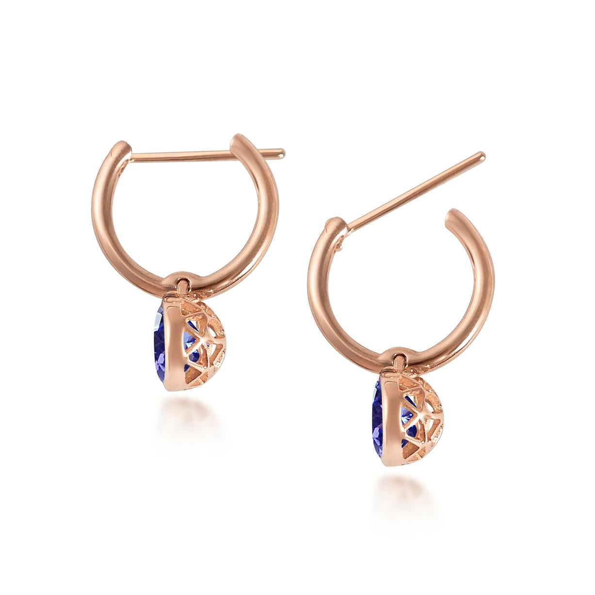 Handcrafted 2.80 Carats Tanzanite 18 Karat Rose Gold Drop Earrings. The 8mm natural stones are set in our iconic hand pierced gold lace to let the light through. Our precious and fine stones on our dangling earrings are highlighted by a diamond on