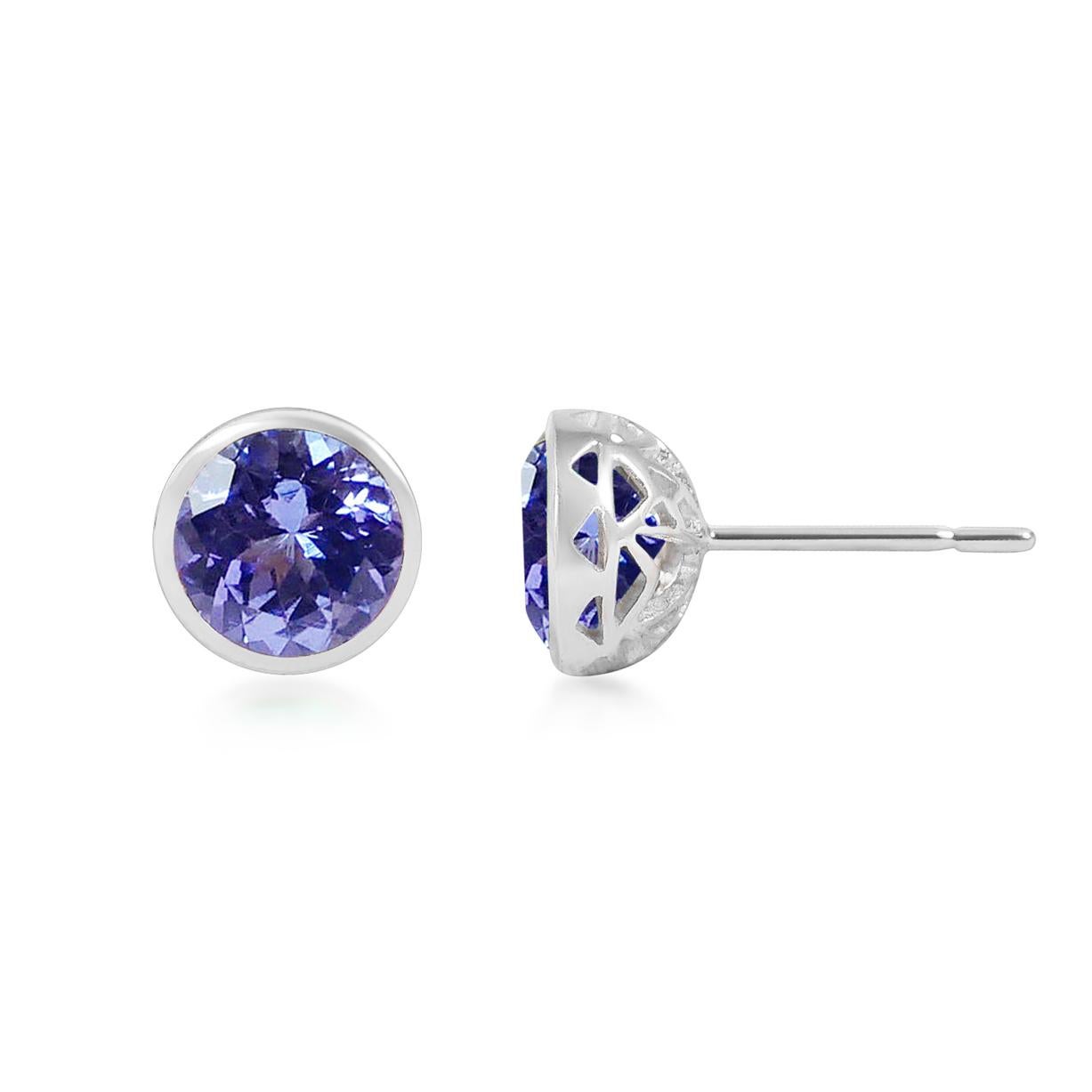 Handcrafted 2.80 Carats Tanzanite 18 Karat White Gold Stud Earrings. The 8mm natural stones are set in our iconic hand pierced gold lace to let the light through our precious and fine stones our earrings are the perfect everyday wear.

This unique