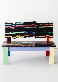 Handcrafted abstract sculptural bench in artist-painted wood