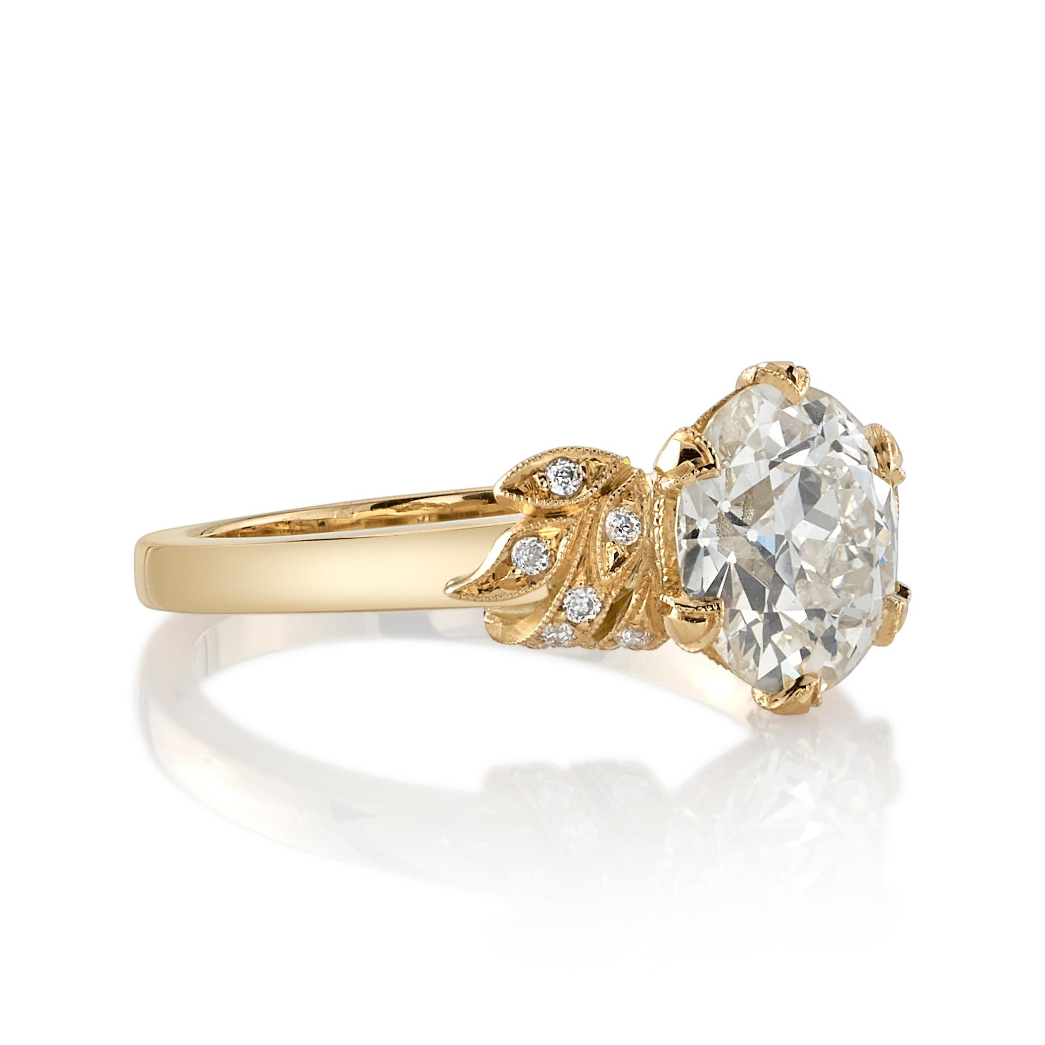 2.01ct O-P/VVS2 GIA certified old European cut diamond with 0.09ctw old European cut accent diamonds set in a handcrafted 18K yellow gold mounting.




