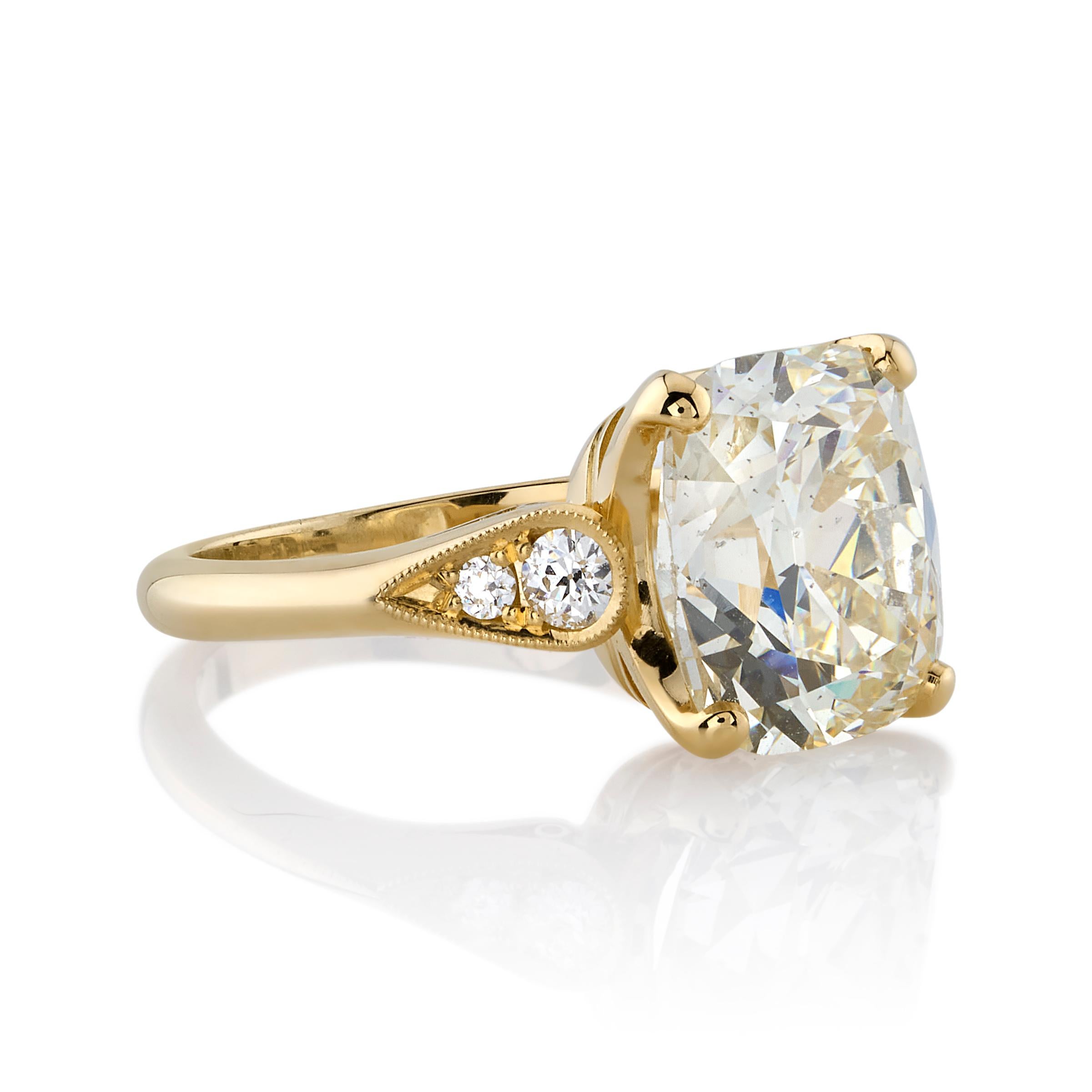 4.96ct O-P/SI2 GIA certified antique Cushion cut diamond with 0.18ctw old European cut accent diamonds set in a handcrafted 18K yellow gold mounting.

Ring is currently a size 6 and can be sized to fit.

Our jewelry is made locally in Los Angeles