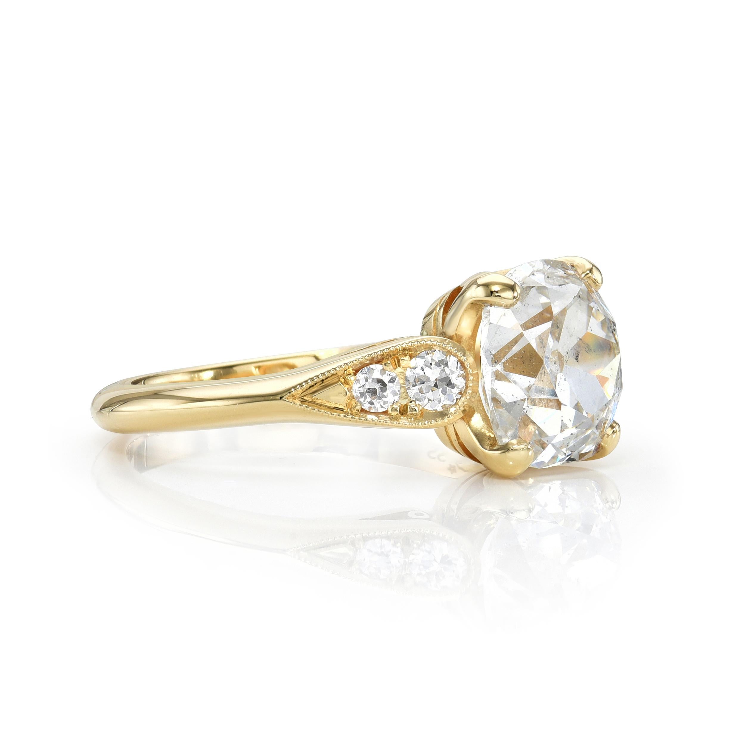 1.99ct F/I2 GIA certified antique cushion cut diamond with 0.14ctw old European cut accent diamonds prong set in a handcrafted 18K yellow gold mounting.