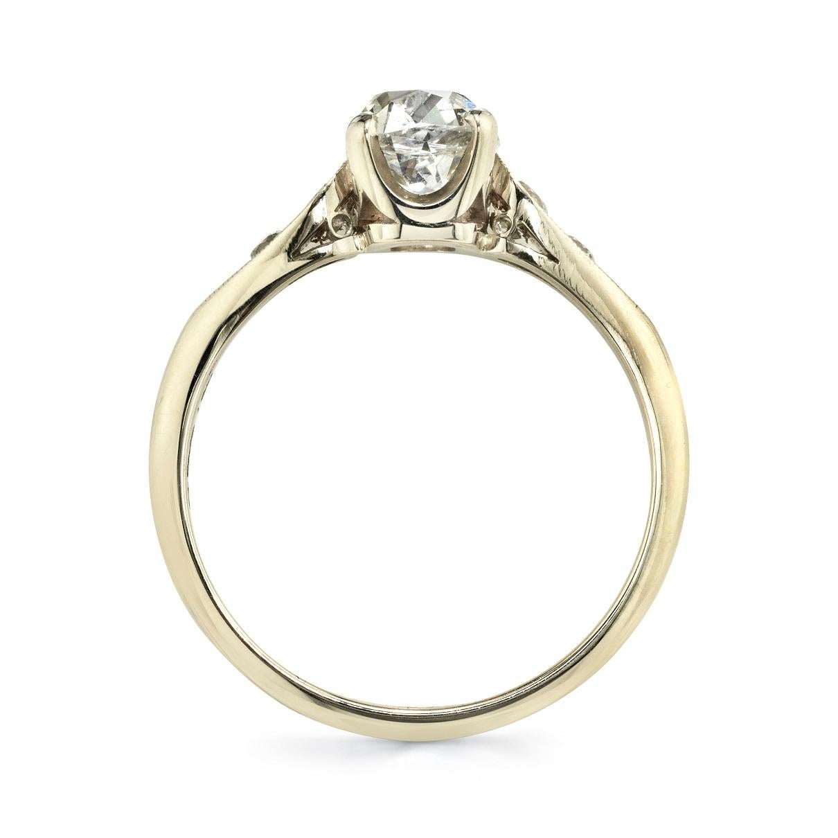1.12ct H/VS2 EGL certified antique cushion cut diamond with 0.22ctw old European cut accent diamonds set in a handcrafted 18K champagne gold mounting.