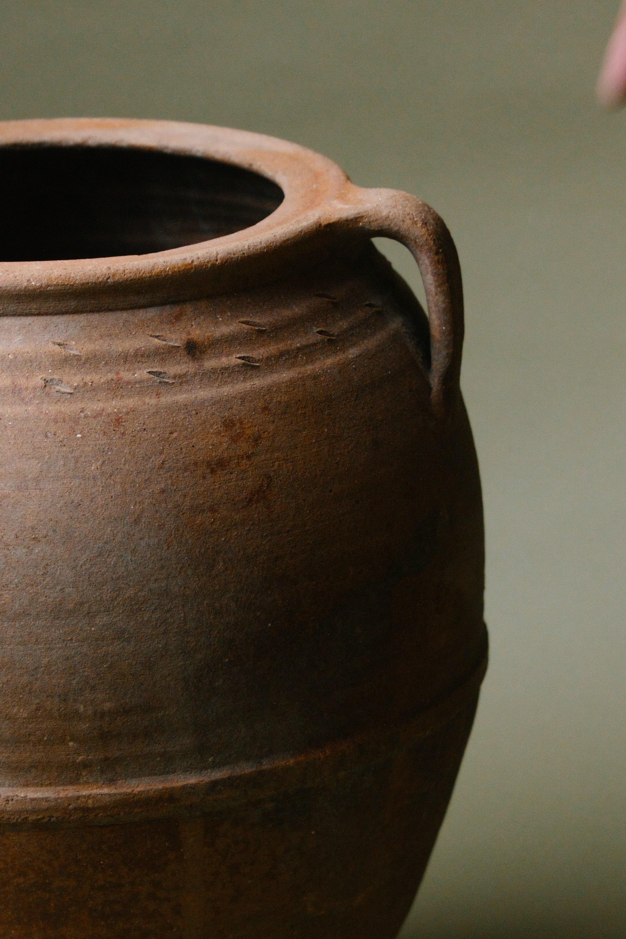 Introducing the Handcrafted Anatolian Rustic Earthenware Storage Vessel, a timeless artefact steeped in the rich traditions of Anatolian pottery. This remarkable vessel hails from the heart of Turkey, specifically from the central Anatolian plains,