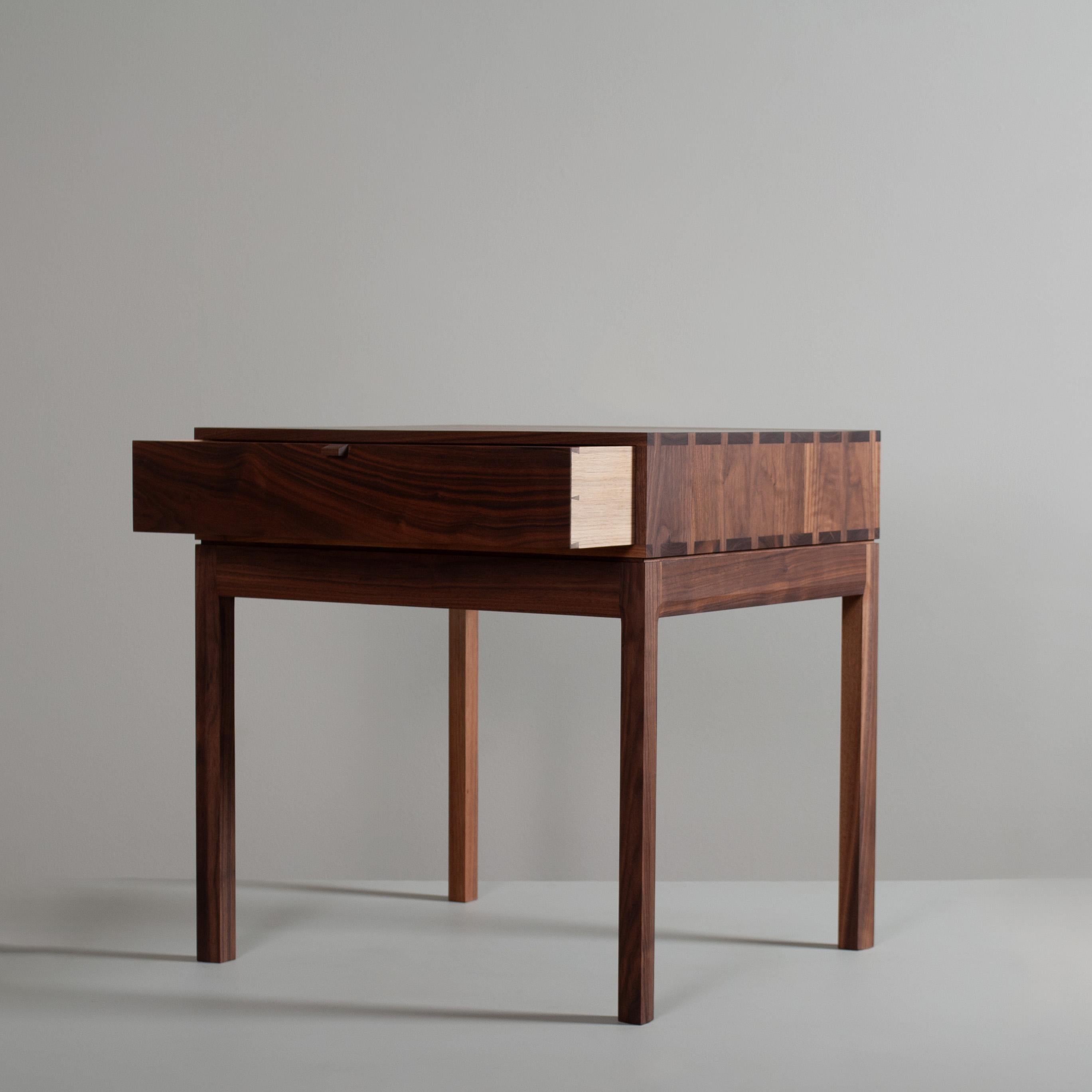 Totally hand-crafted American black walnut artisan drawer tables. These are constructed from the finest American black walnut with the inner traditionally dovetailed jointed drawer in prime English Oak. The main upper box is detailed with fully