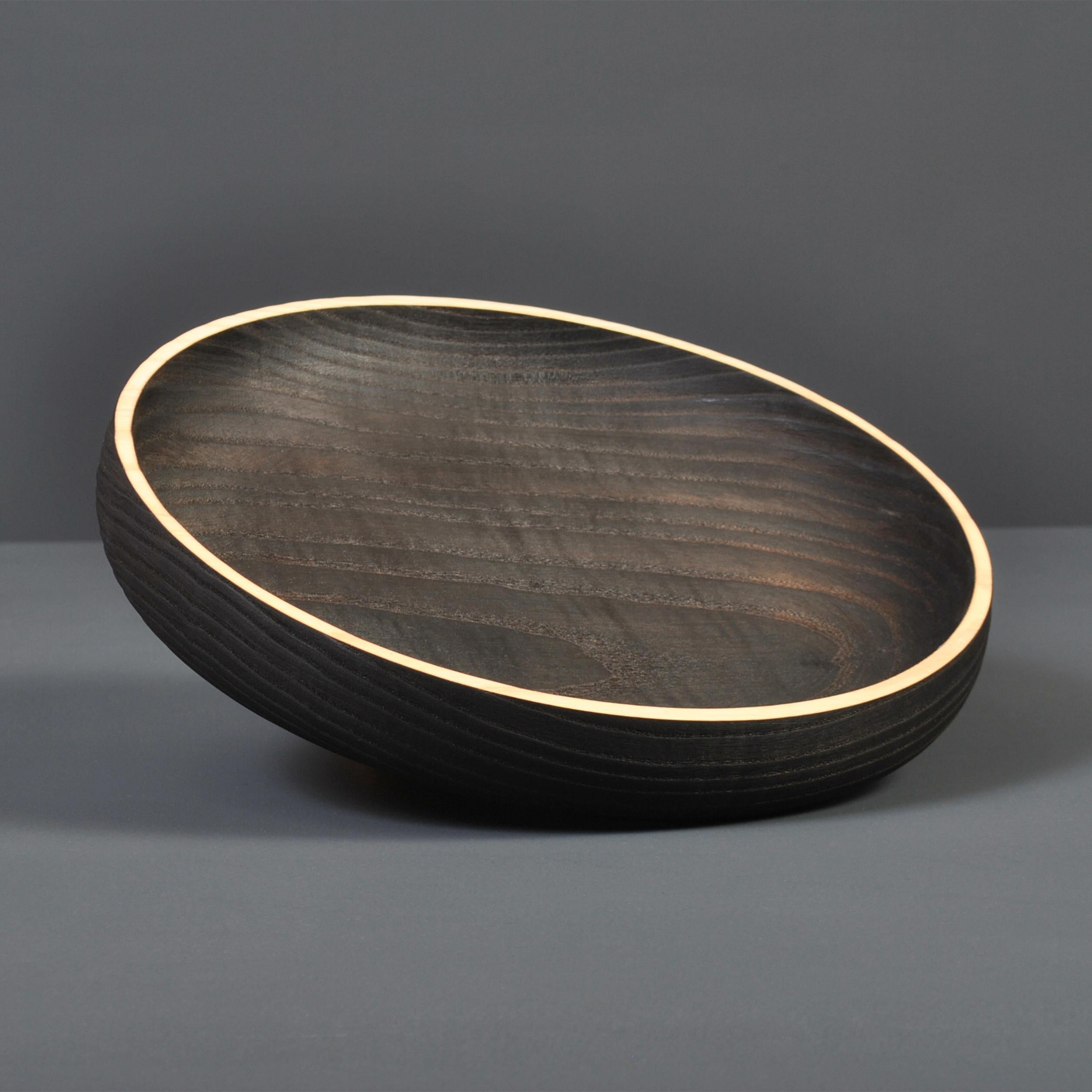 Fine traditionally hand-crafted and turned Ash platter finished with Japanese scorched yakisugi technique and natural rim. These are handmade to the very best quality in London.
Finished in food safe oils.
A beautiful piece of handmade contemporary