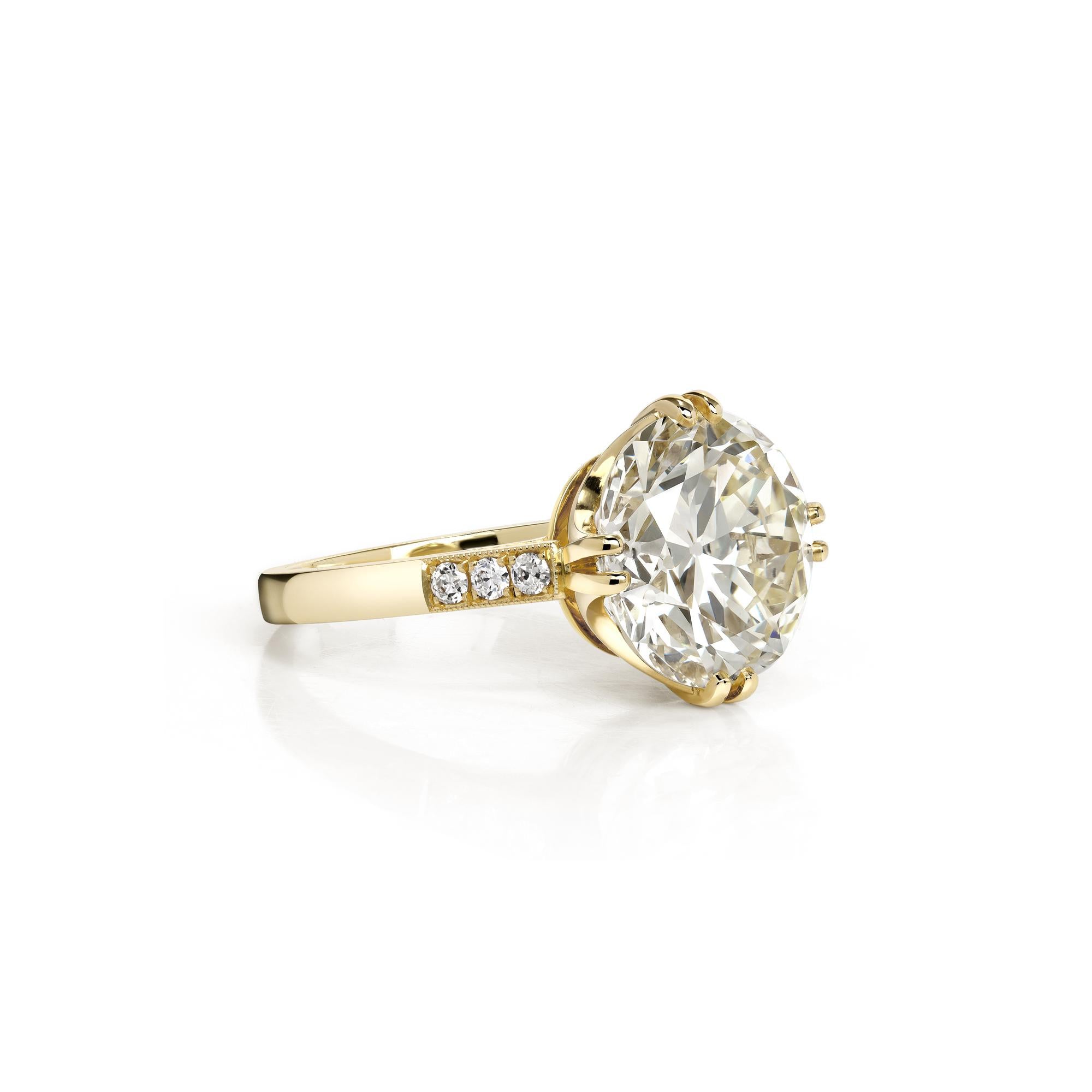 3.33ct M/VS2 GIA certified old European cut diamond with 0.09ctw old European cut accent diamonds prong set in a handcrafted 18K yellow gold mounting.
