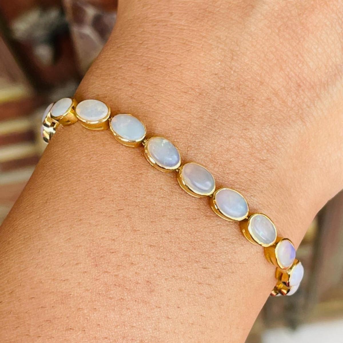 Handcrafted Bezel Set Oval Opal Tennis Bracelet in 18k Yellow Gold for Women For Sale 1