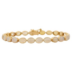 Bracciale tennis con castone ovale incastonato a mano in oro giallo 18 carati per donna