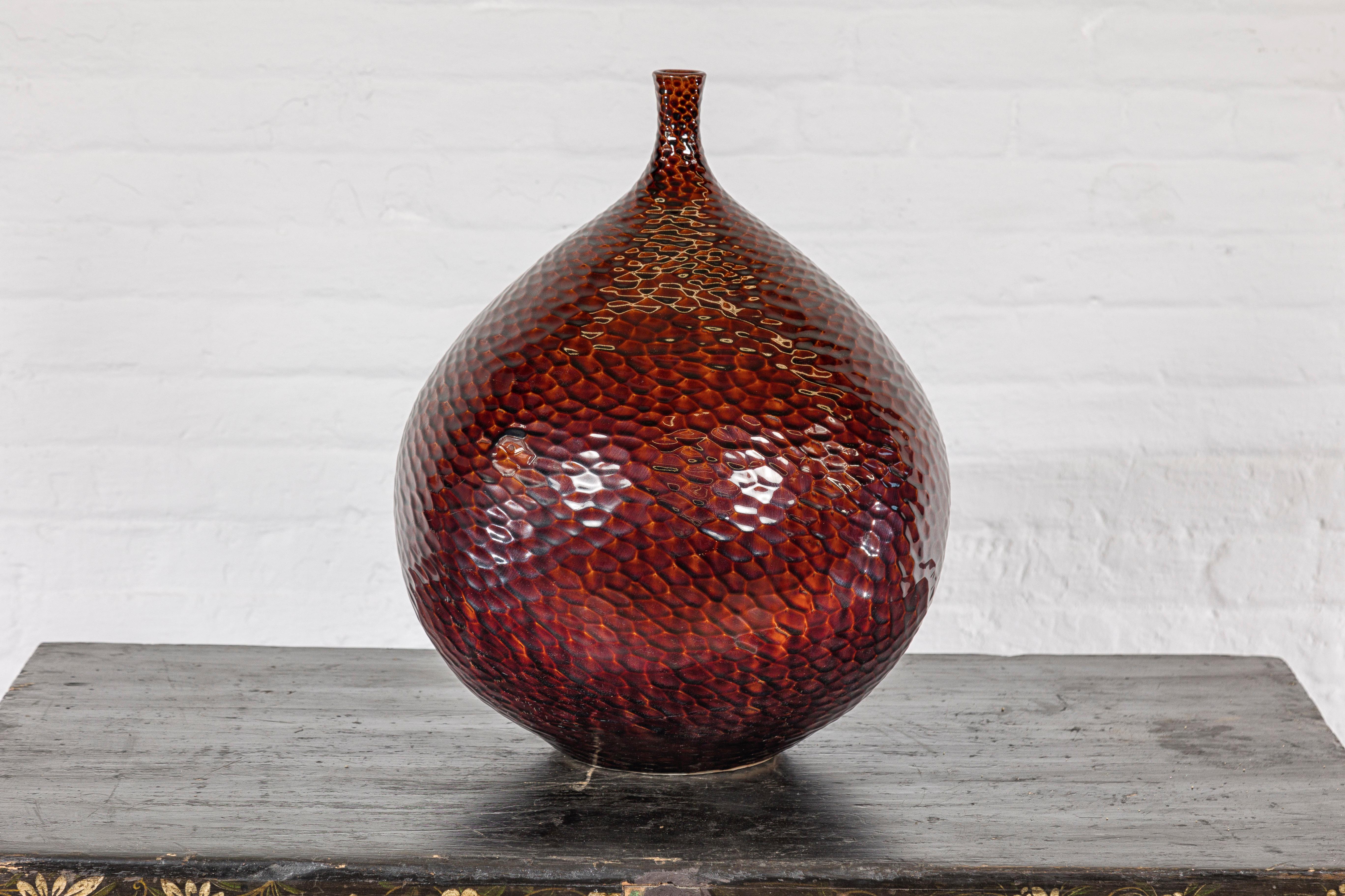Glazed Handcrafted Bulb Shaped Burgundy Vase with Textured Honeycomb Style Motifs For Sale
