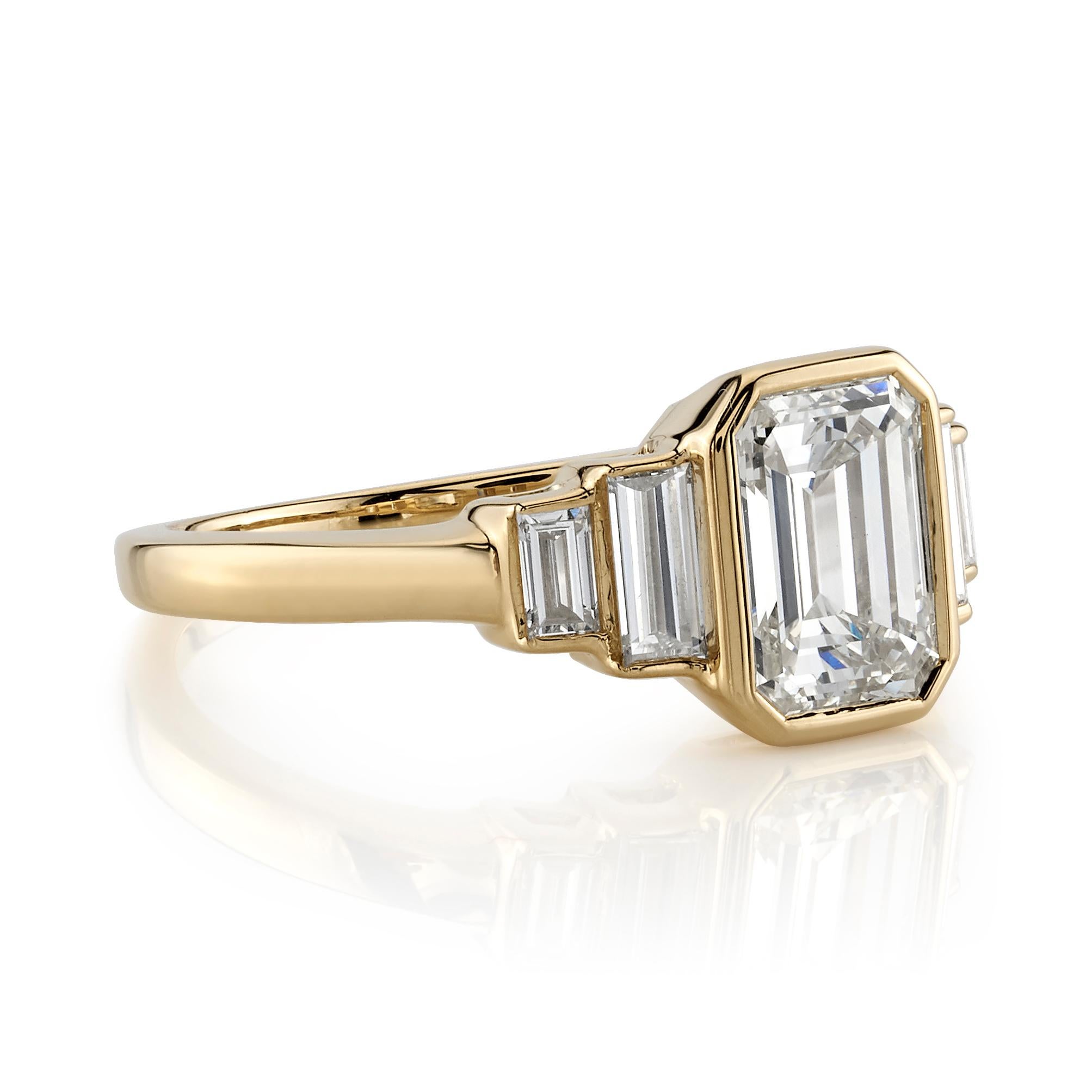 2.07ct K/VVS1 GIA certified emerald cut diamond with 0.57ctw baguette cut accent diamonds bezel set in a handcrafted 18K yellow gold mounting.

 