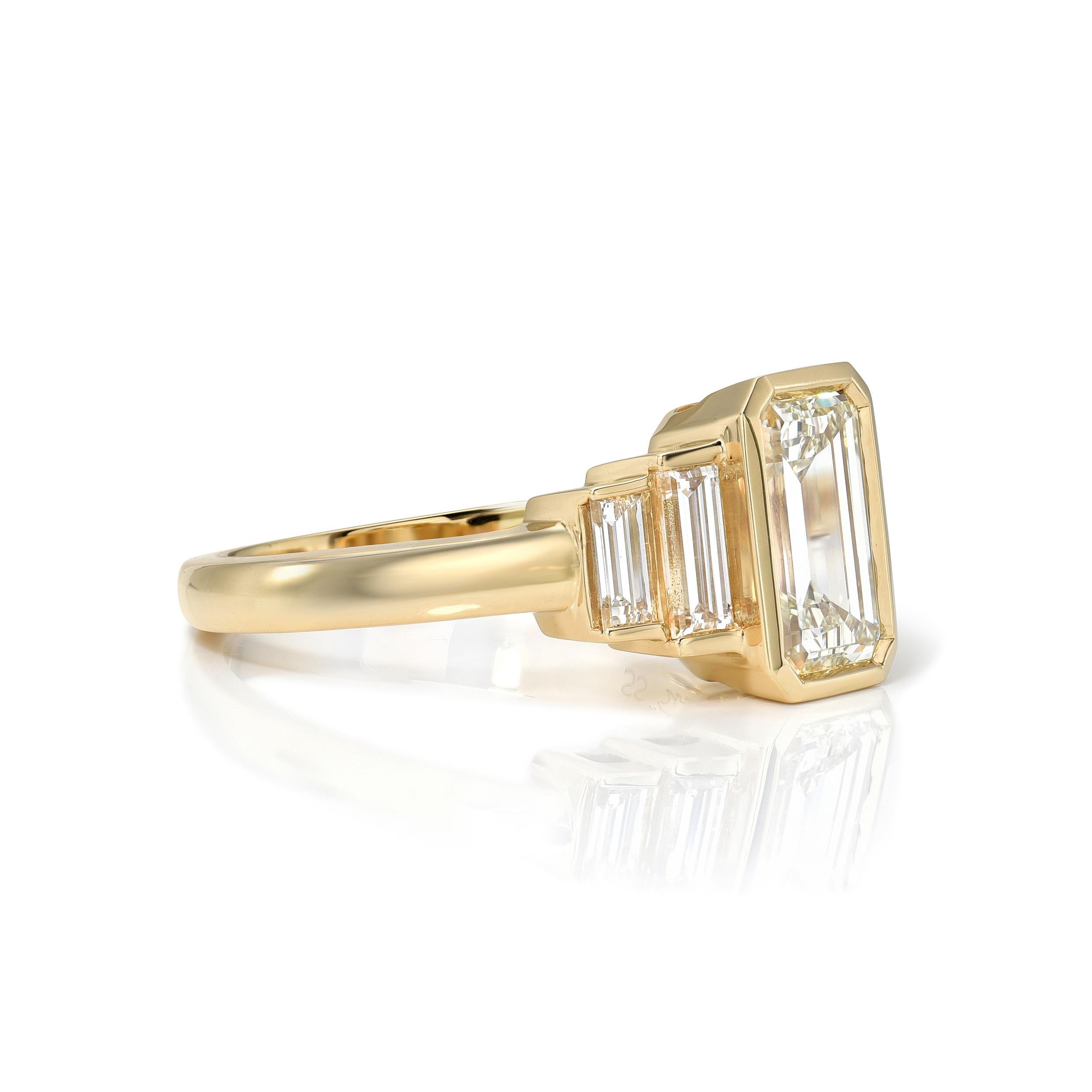 1.52ct L/IF GIA certified emerald cut diamond with 0.58ctw baguette cut accent diamonds bezel set in a handcrafted 18K yellow gold mounting.