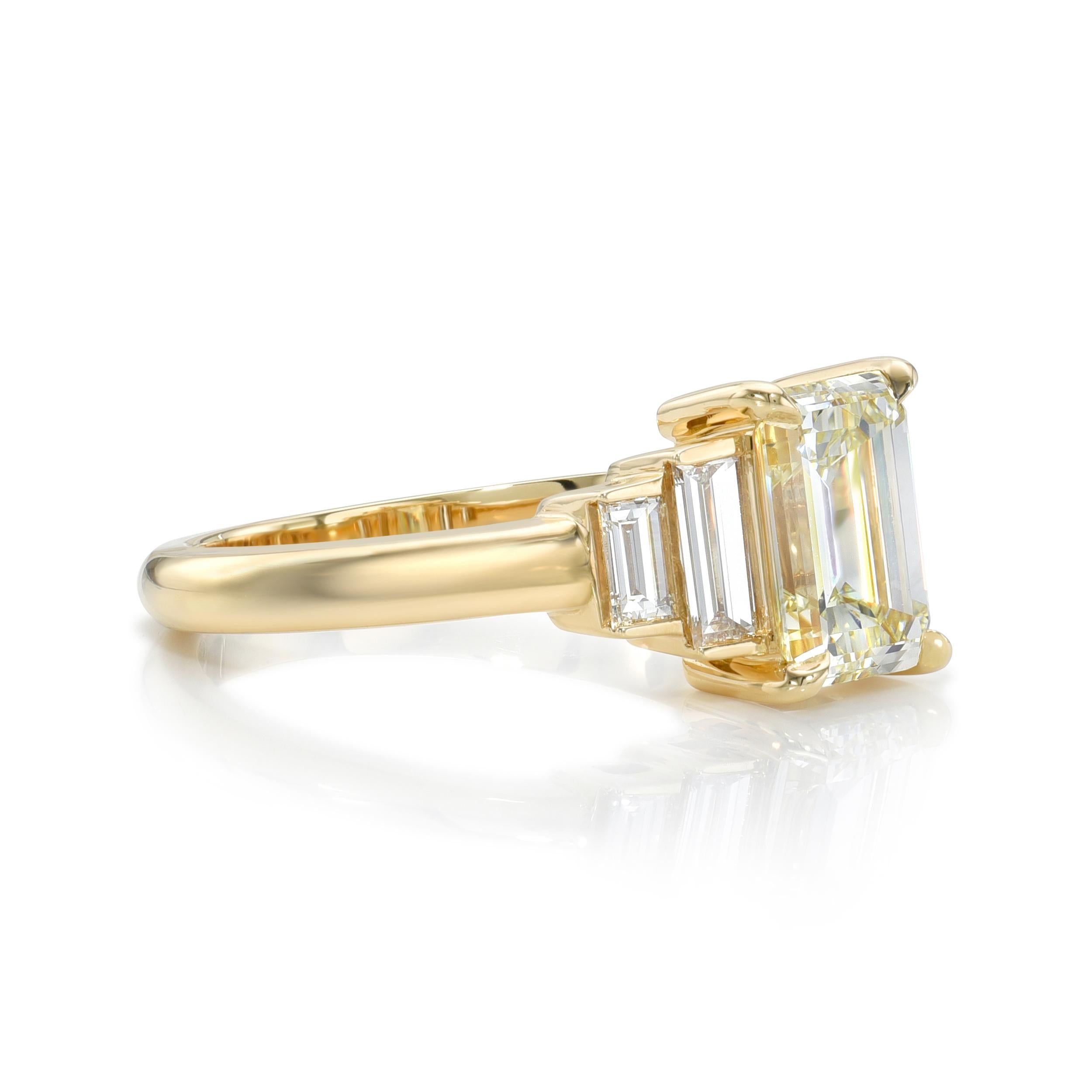 1.51ct N/VS2 GIA certified emerald cut diamond with 0.41ctw baguette cut accent diamonds prong set in a handcrafted 18K yellow gold mounting.