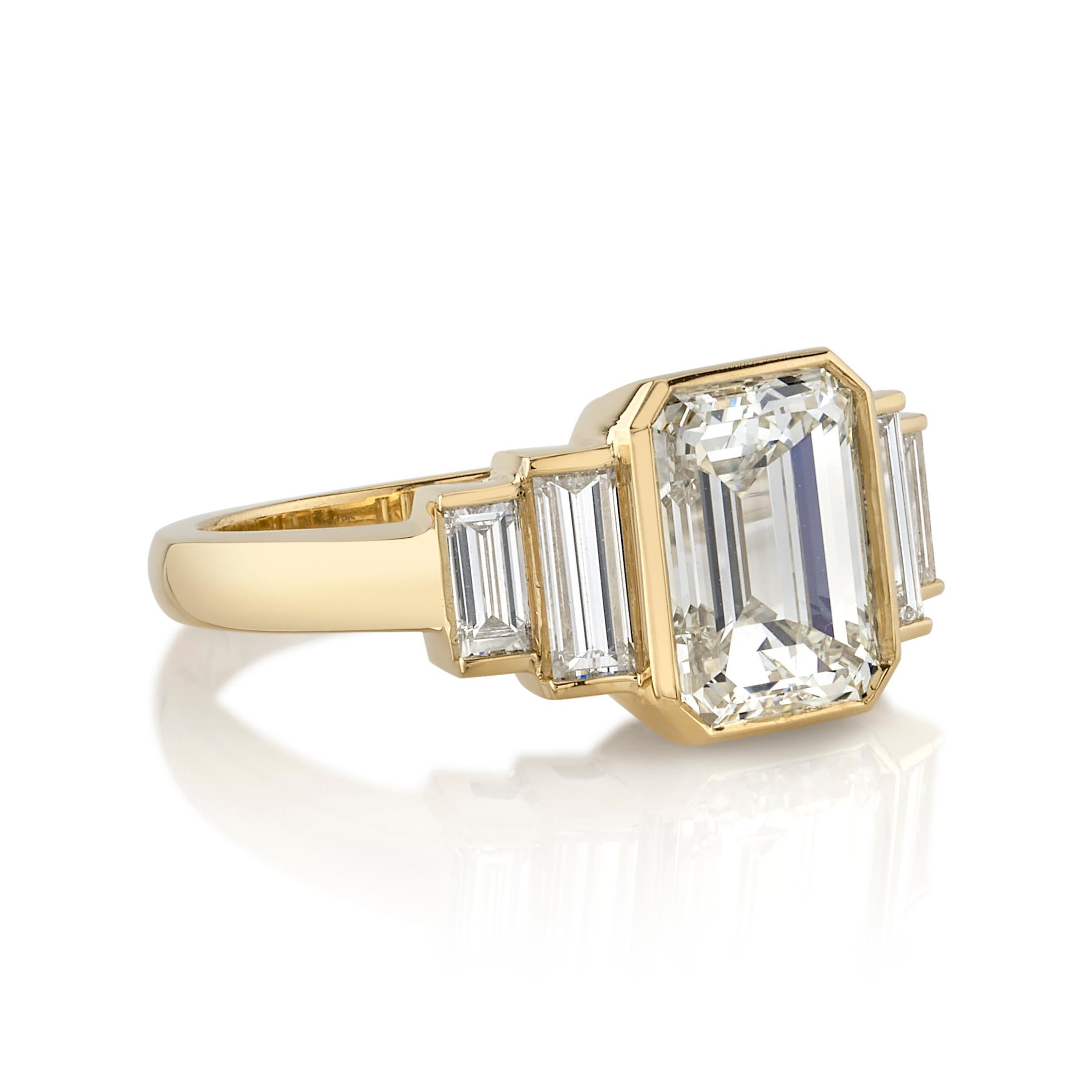 2.42ct M/VS2 GIA certified Emerald cut diamond with 0.66ctw Baguette cut accent diamonds set in a handcrafted 18K yellow gold mounting.

Ring is currently a size 6 and can be sized to fit. 

Our jewelry is made locally in Los Angeles and most pieces