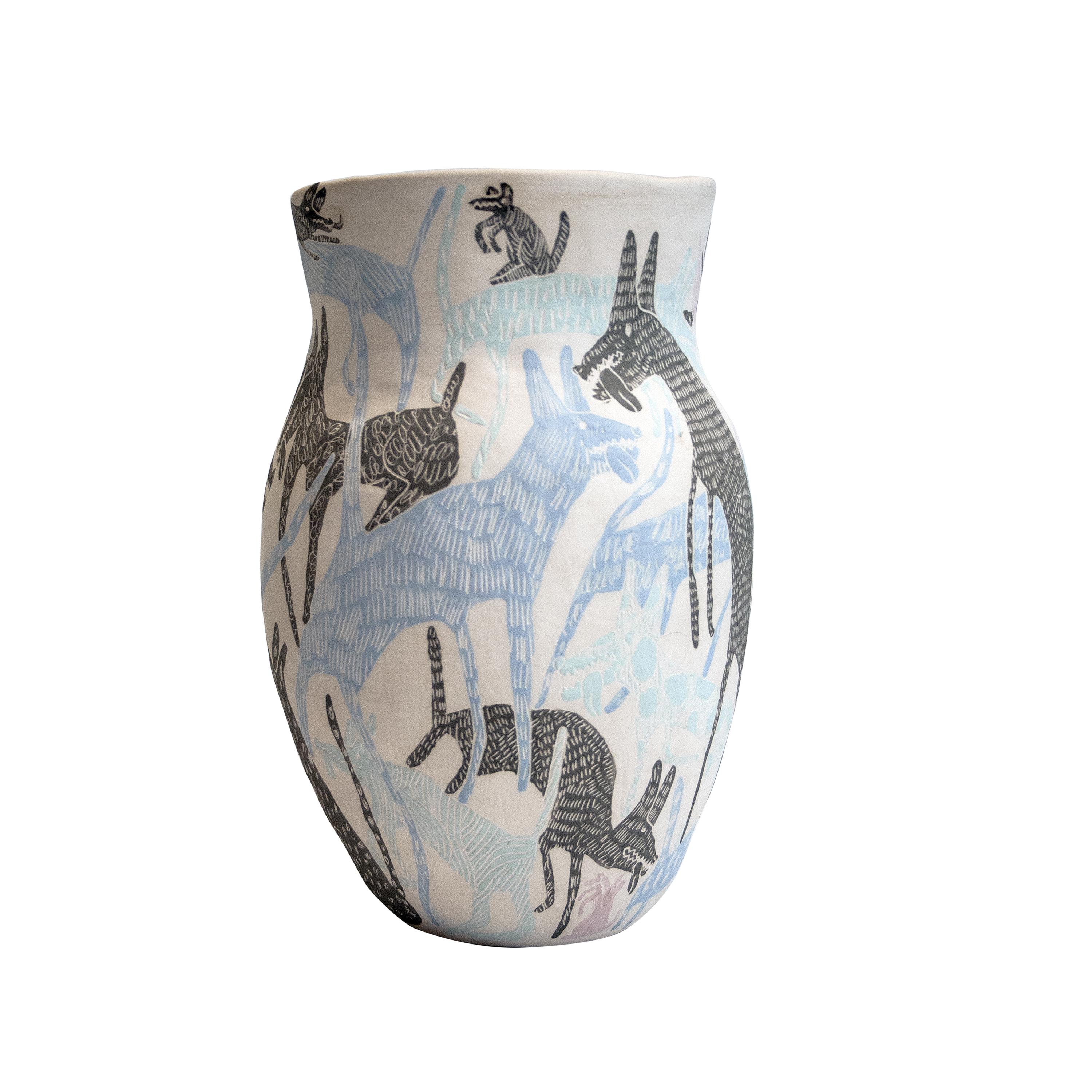 This handmade vase was designed and made by the collaboration of Spanish designers Carlos Jiménez, better known as `“Del Amor y la Belleza”´´, and Ranma.
The vase is made of ceramic at low temperatures and illustrated with animal motifs using the