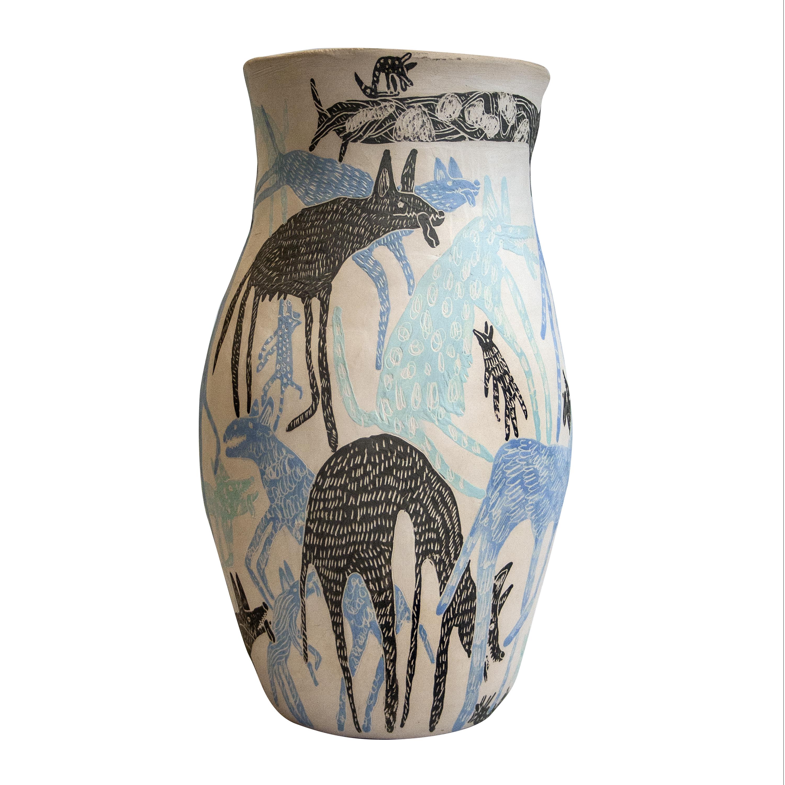 This handmade vase was designed and made by the collaboration of Spanish designers Carlos Jiménez, better known as `“Del Amor y la Belleza”´´, and Ranma.
The vase is made of ceramic at low temperatures and illustrated with animal motifs using the