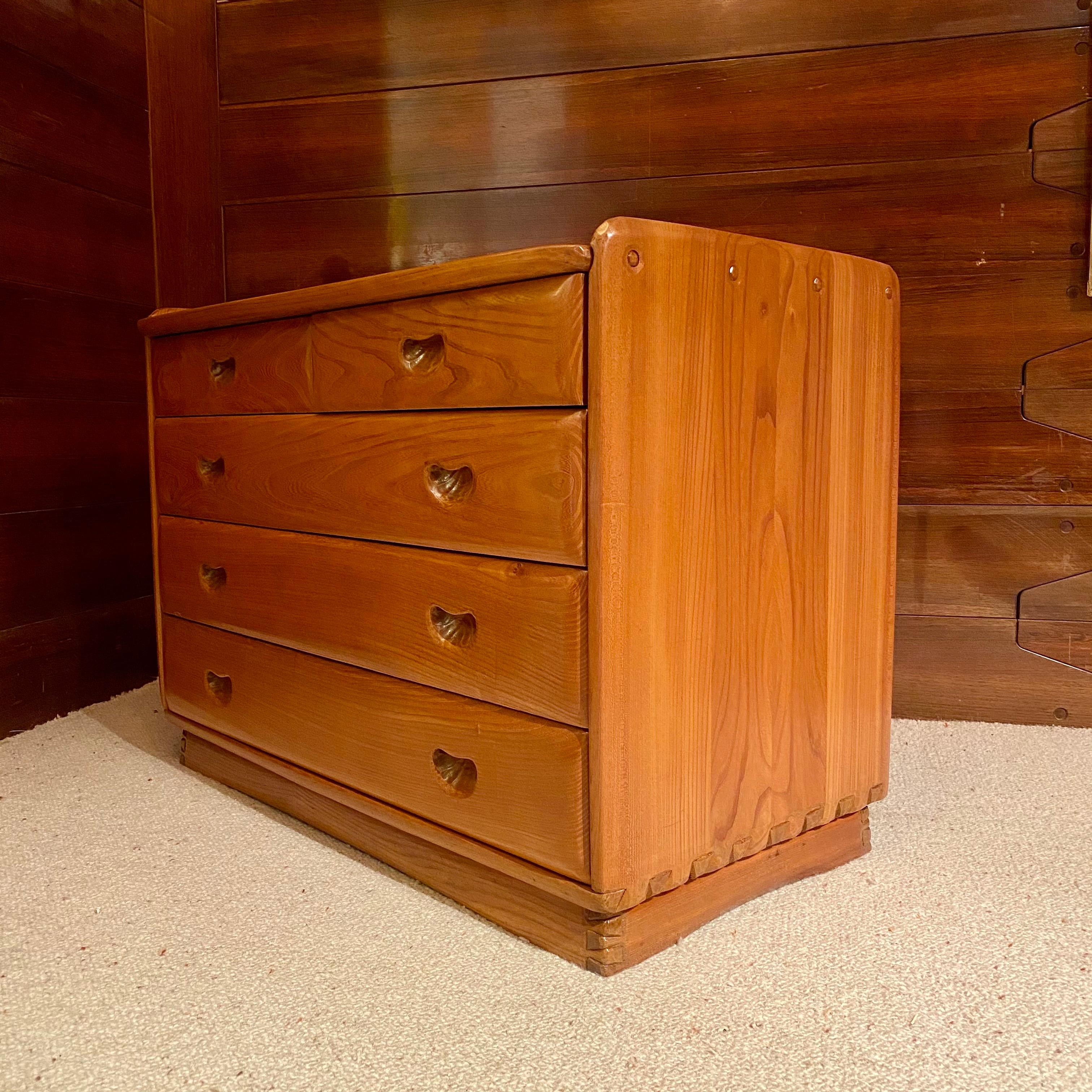 Chest of drawers in elm by the famous Swiss Cabinetmaker, Franz Xaver Sproll. Assembly work and carved details in the manner of Alexandre Noll, did in the same period.