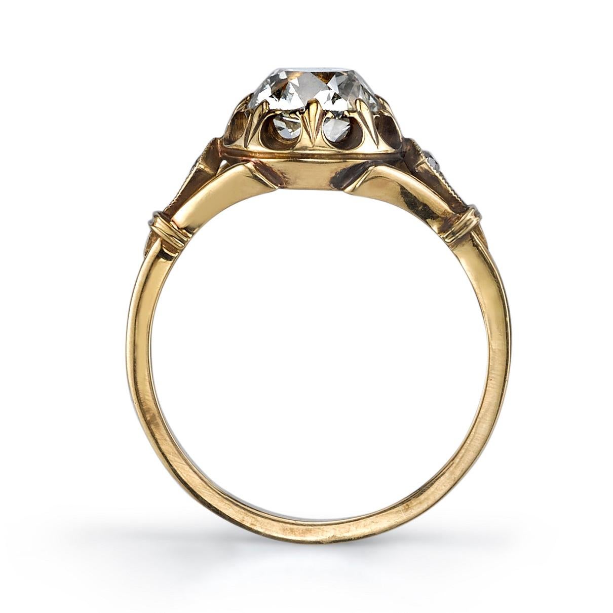 1.07ct L/SI1 EGL certified antique cushion cut diamond with 0.06ctw old European cut accent diamonds set in a handcrafted oxidized 18K yellow gold mounting.