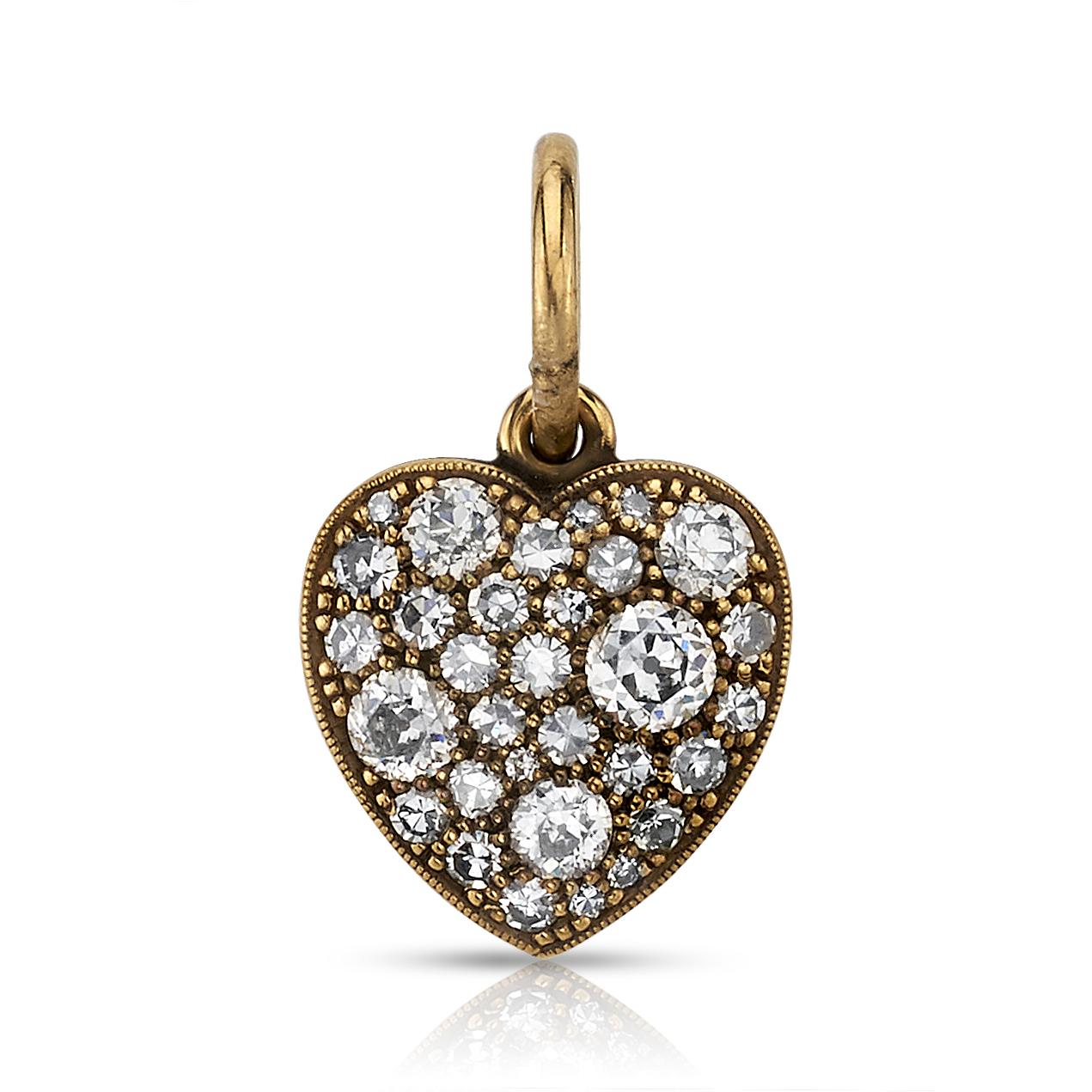 Approximately 0.80ctw varying old cut and round brilliant cut diamonds in a handcrafted 18k yellow gold heart pendant. Available in an oxidized or polished finish. Prices vary according to diamond weight. Price does not include chain.

*Cobblestone