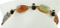 Handcrafted Colored Sapphires, Diamonds, Onyx, Yellow and White Gold Bracelet