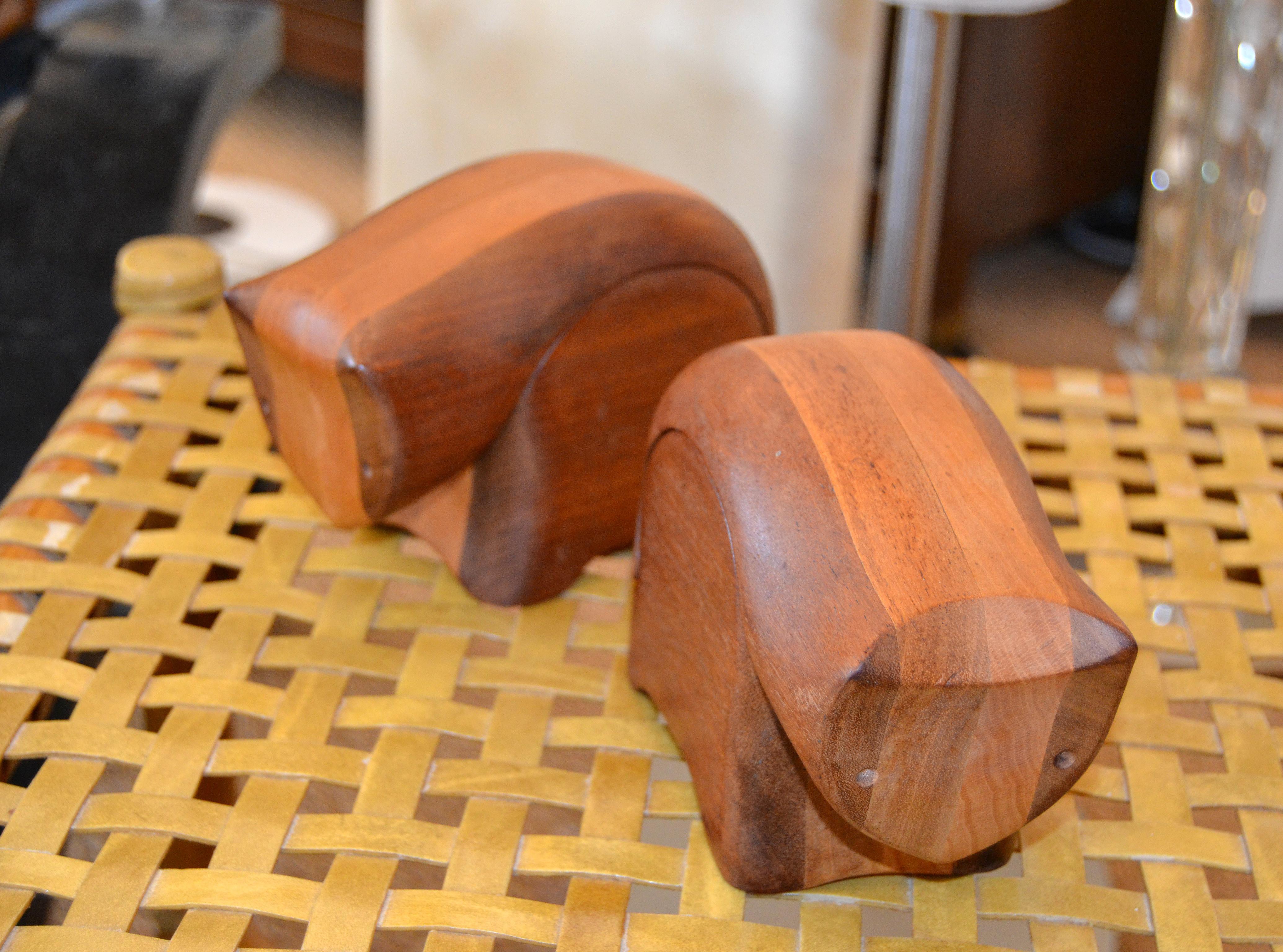 A pair of handcrafted animal figures, sculpture, keepsake or jewelry box.
Made out of the finest mahogany and tropical beechwood planks laminate into alternating layers.
Individual critters are cut to shape, meticulously hand sanded, carefully