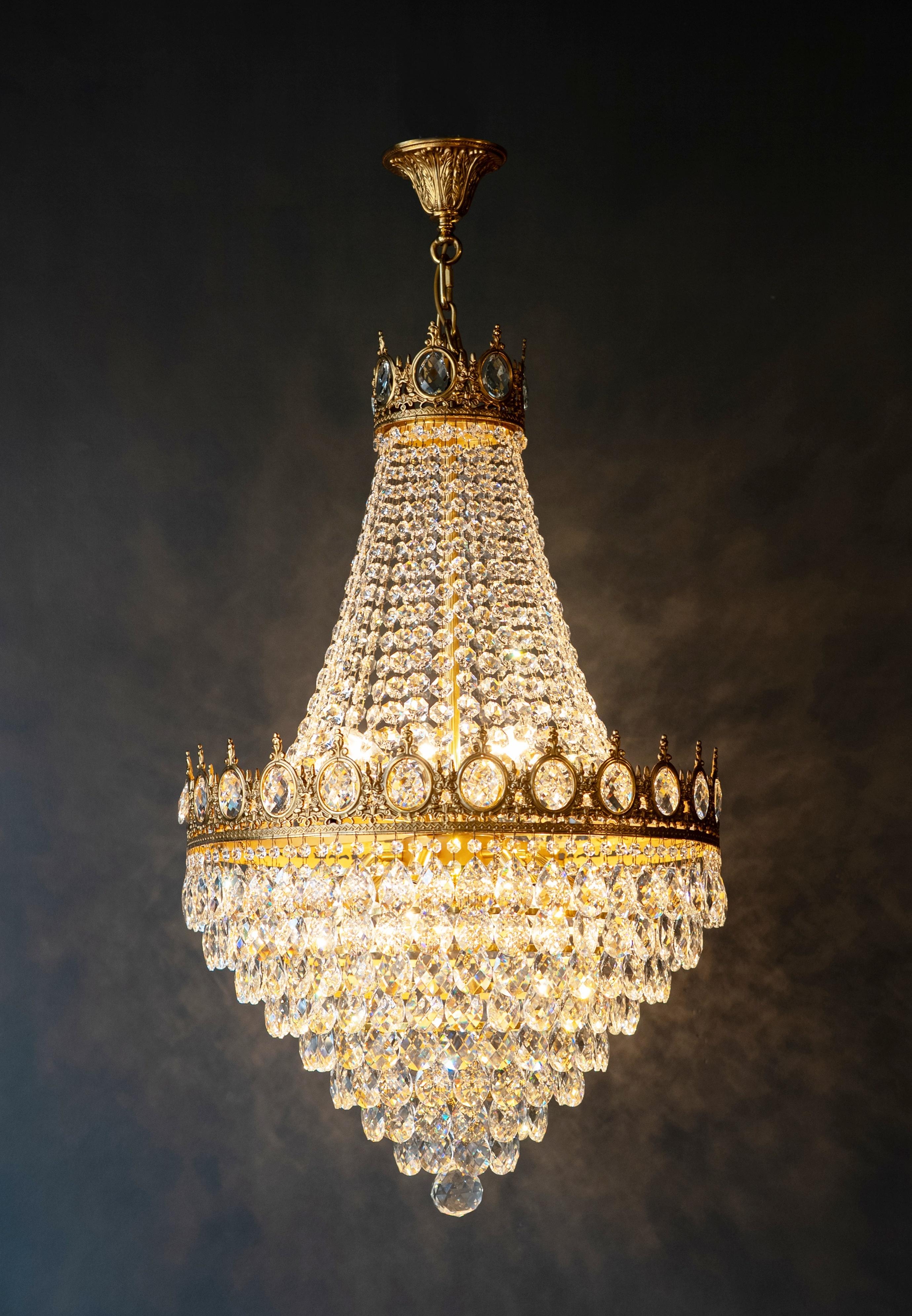 Handcrafted Crystal Chandelier made of Solid Brass with Gold Finish Twelve Light Ceiling Fixture with Hand Tied Crystals – Diameter 62 cm Height 95 cm Total Height 120 cm – In House Production

Add a touch of refined elegance to your interior with