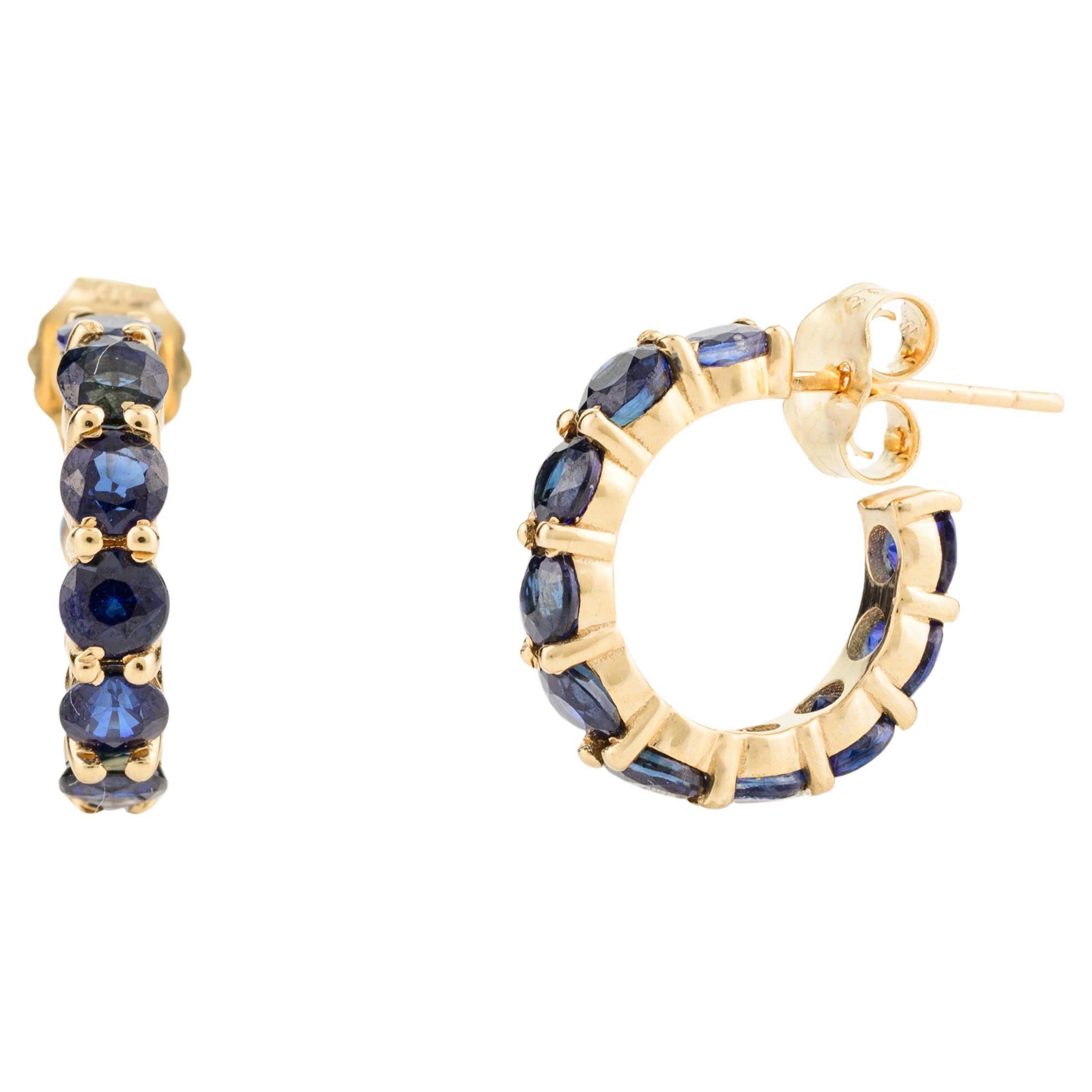 Handcrafted Dainty Blue Sapphire Huggie Hoop Earrings in 18k Solid Yellow Gold For Sale
