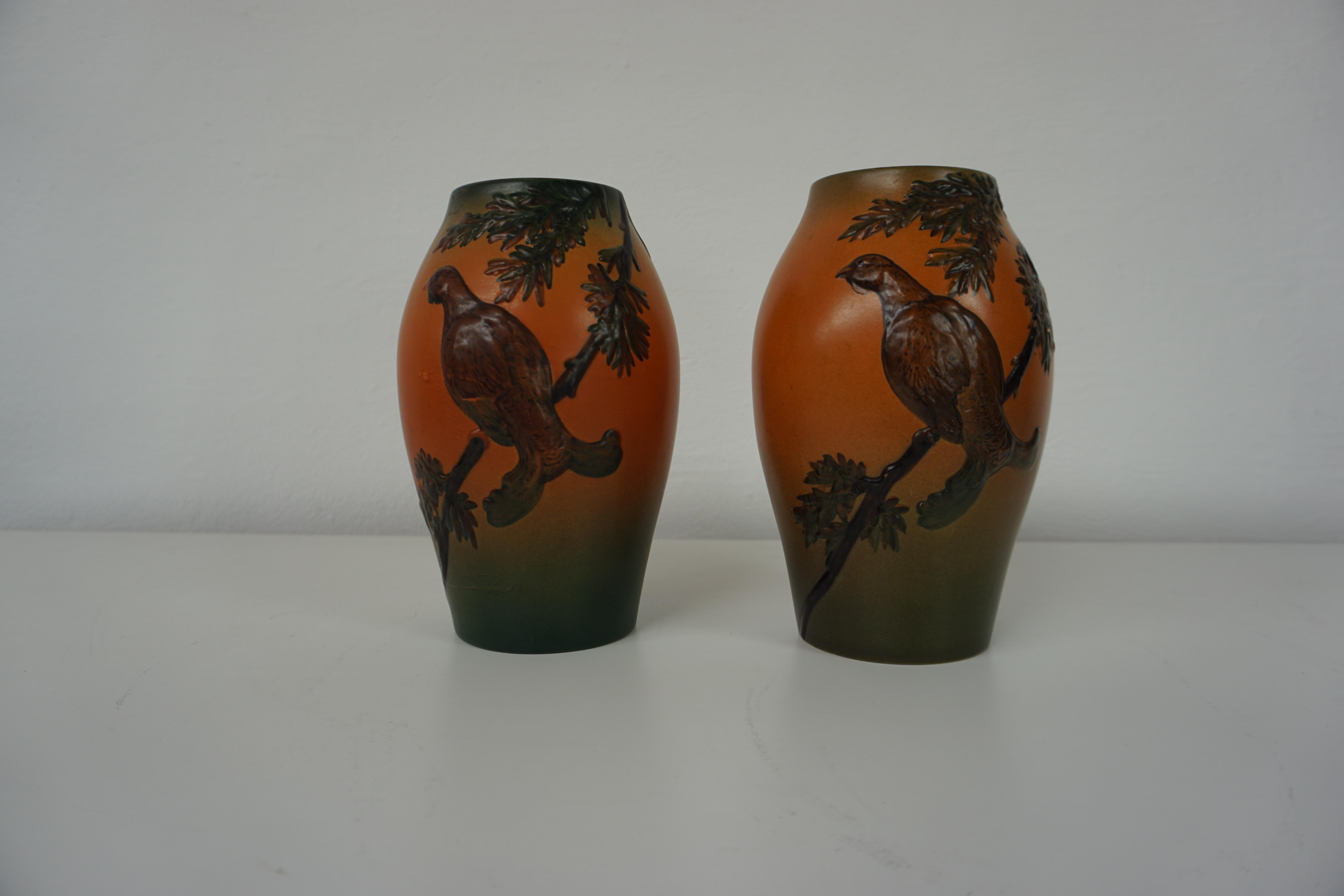 Hand-crafted Danish Art Nouveau flower decorated vases by West in 1927 for P. Ipsens Enke

The art nouveau vases feature very black grouses with branches and leafs are in very good condition.

P. Ipsens Enke (1843 - 1955) was a very succesfull