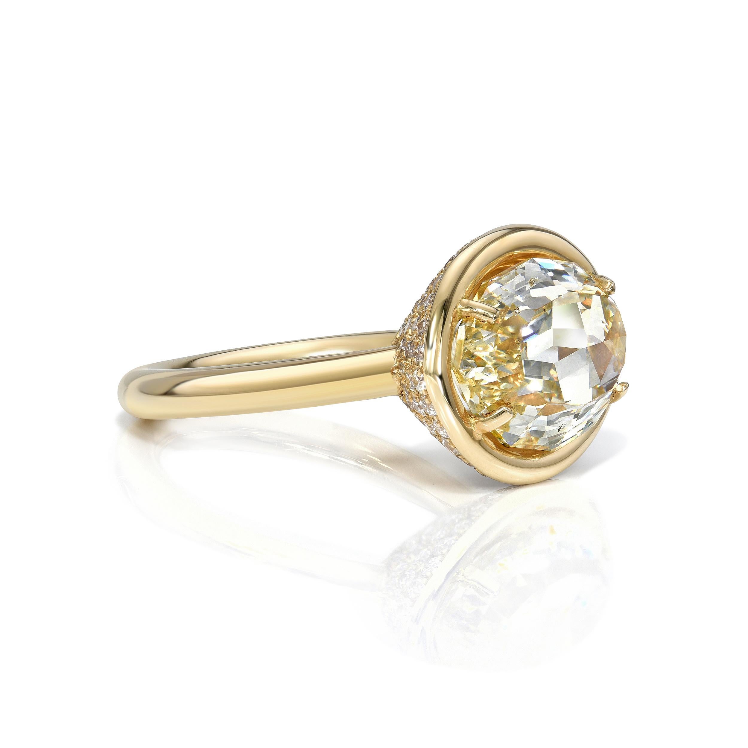 5.21ct Fancy Lt. Browish Yellow/SI2 GIA certified oval cut diamond with 0.85ctw old European cut accent diamonds set in a handcrafted 18K yellow gold mounting.